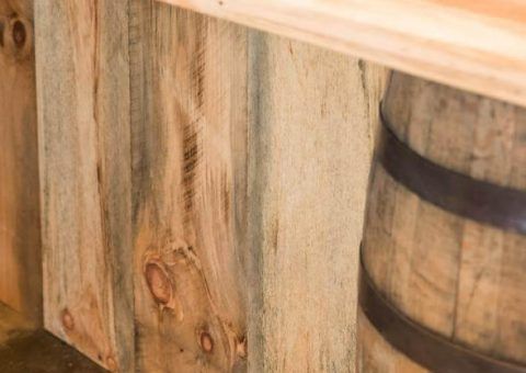 Wood paneling with barrel, warm brown and grey tones.