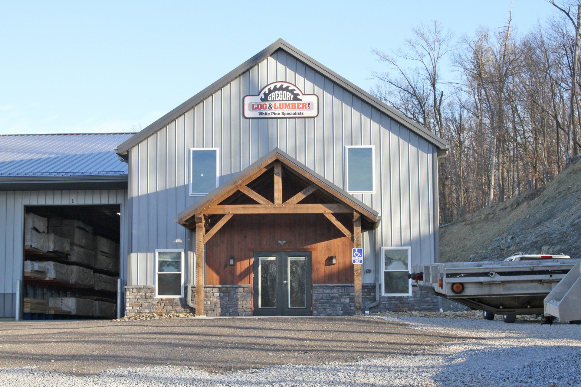 Gray metal building with wooden entrance, 
