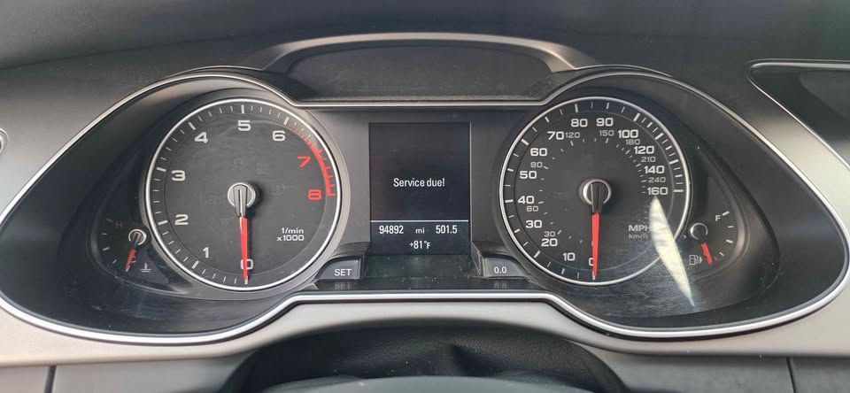 Car dashboard instrument cluster with speedometer, tachometer, and digital display