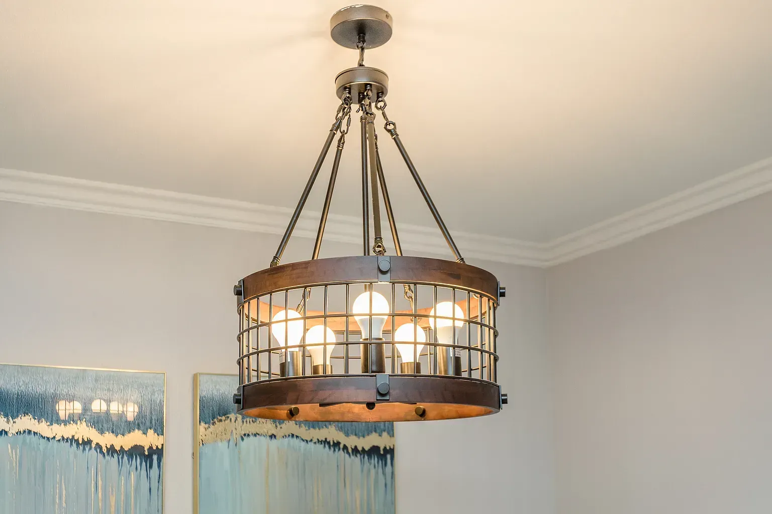 Chandelier-style ceiling light with a metal cage and multiple bulbs.