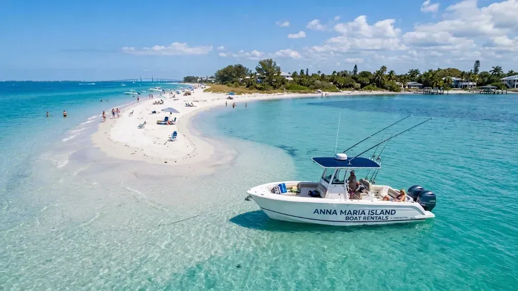A wide shot of a pristine center console boat anchored near an Anna Maria Island sandbar with clear blue water