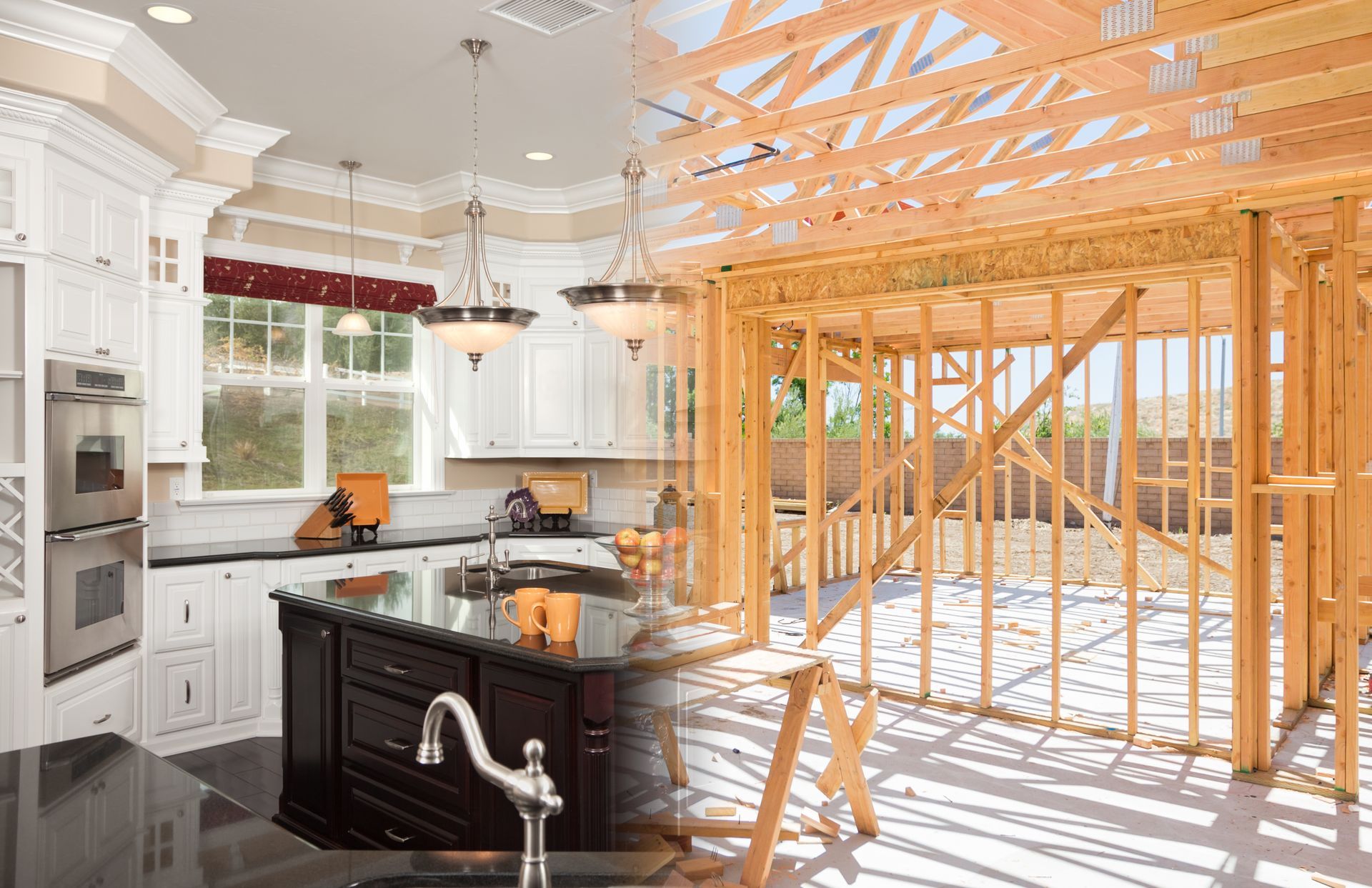 Kitchen under construction with exposed wooden framing and white cabinetry, viewed from the island.