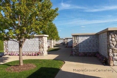 A cemetery filled with lots of vases and flowers
