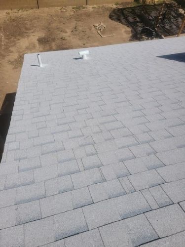 A close up of a roof with shingles on it.