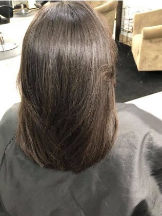 Dark brown layered haircut.