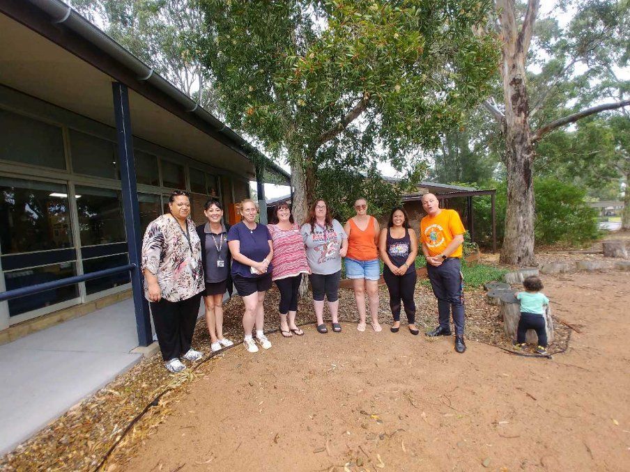 a group of people standing in front of a building