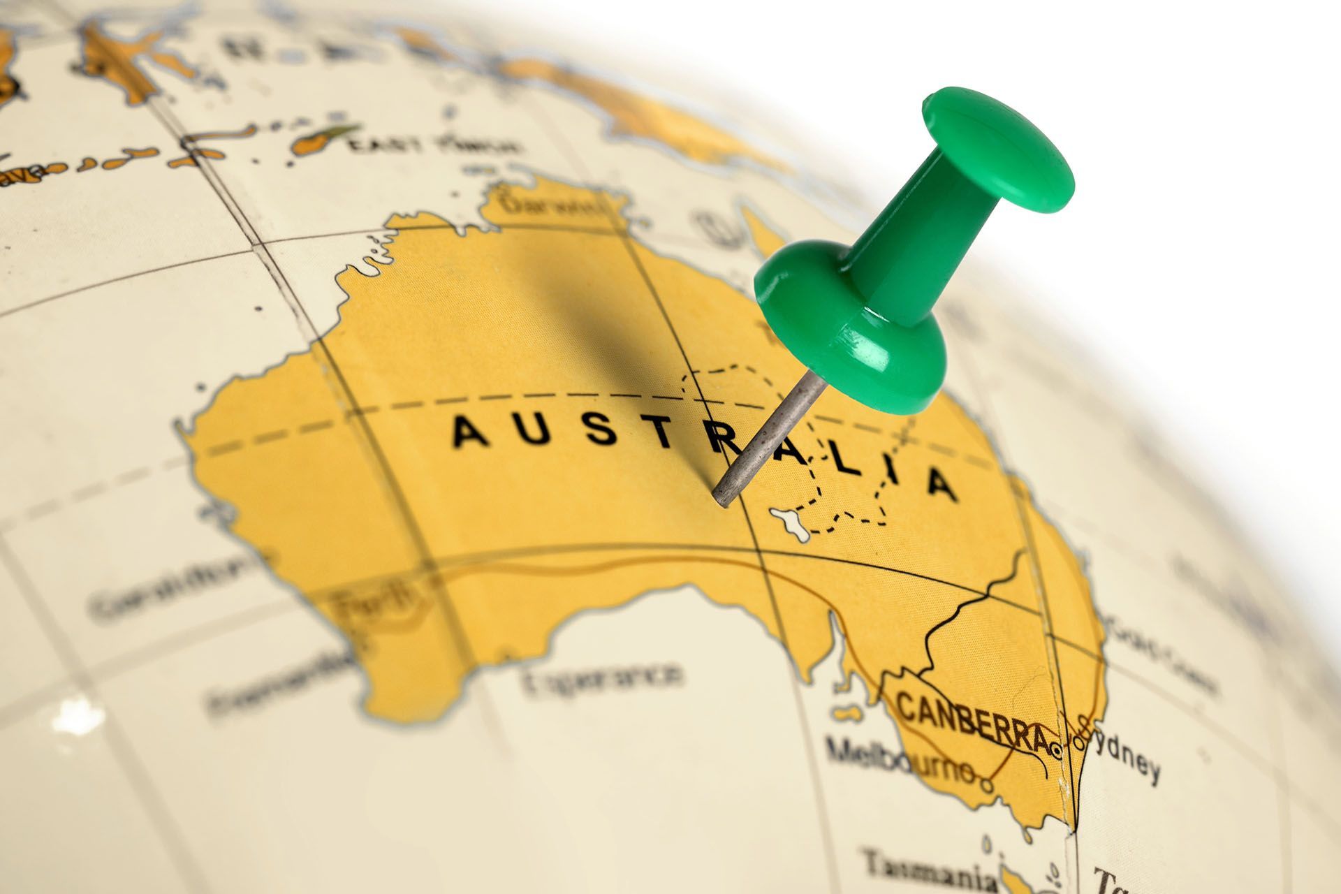 A green pin is pinned to a map of australia