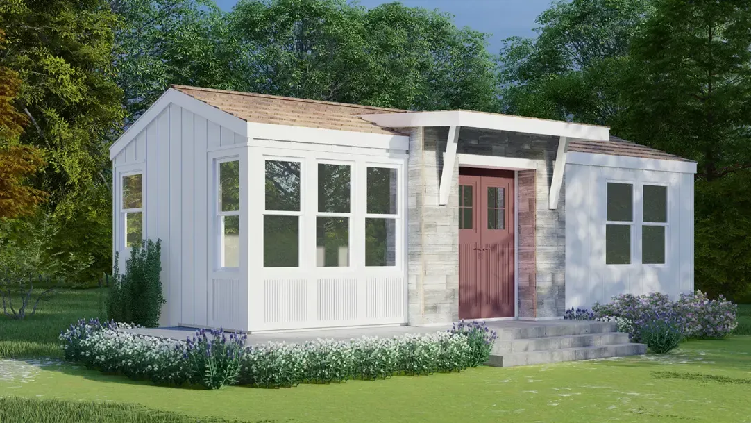 Perpetual Homes ADU: Small white house with bay window, stone entry, and red door. Set in a green yard with bushes and trees.