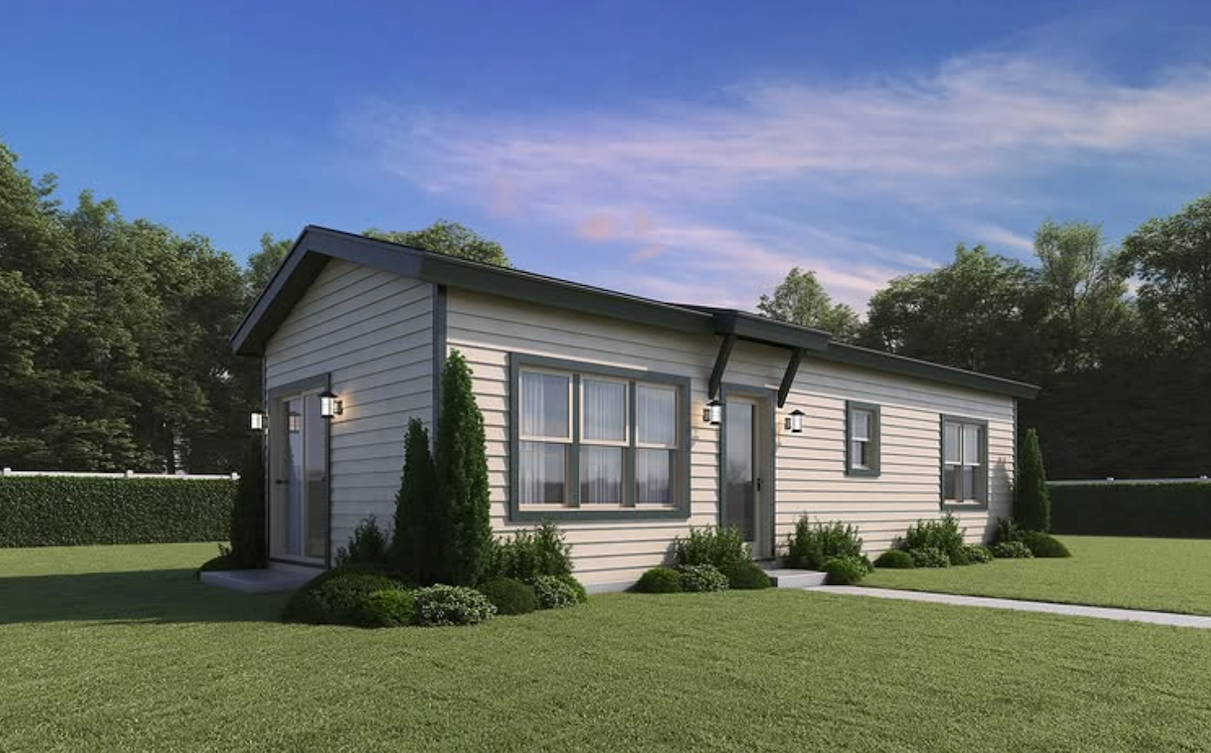 Perpetual Homes: Benicia ADU. A white prefab 1-bedroom ADU home with a glass door, a concrete path through a grass lawn.