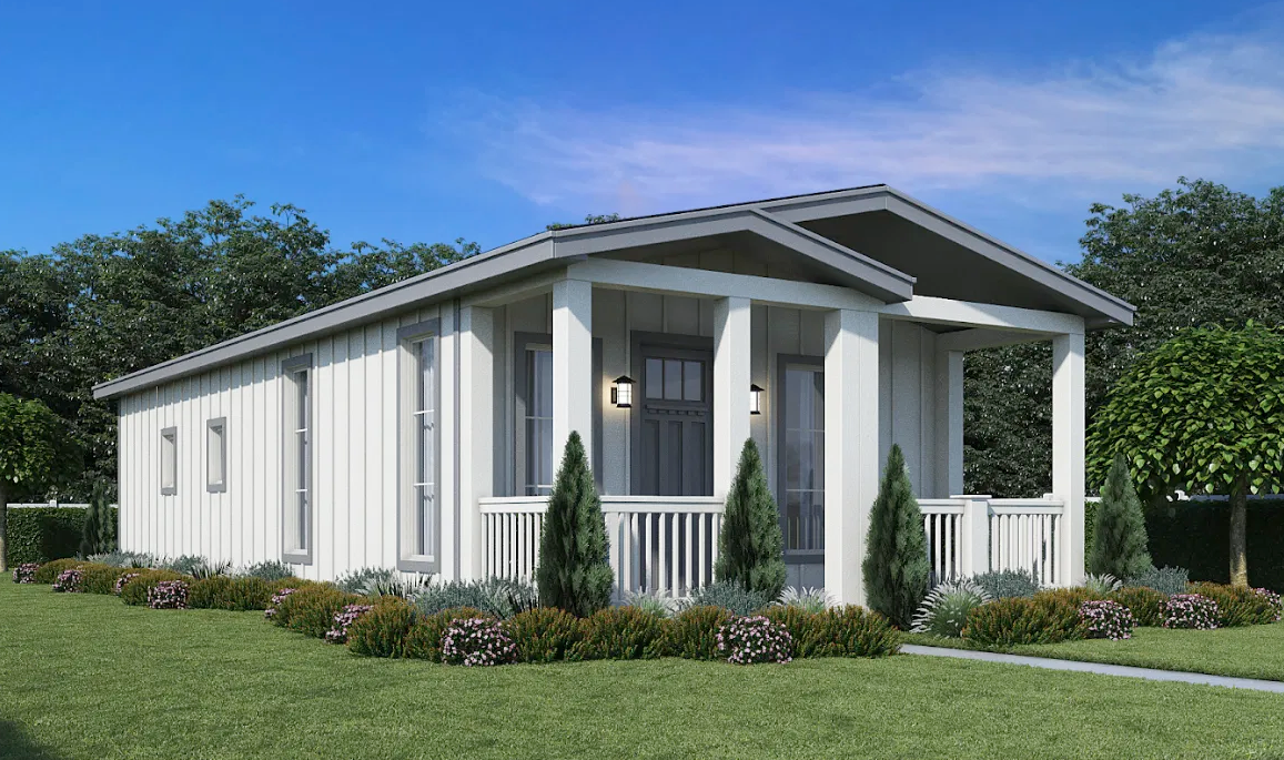 Perpetual Homes ADU: White modern house with covered porch, landscaping, and blue sky.