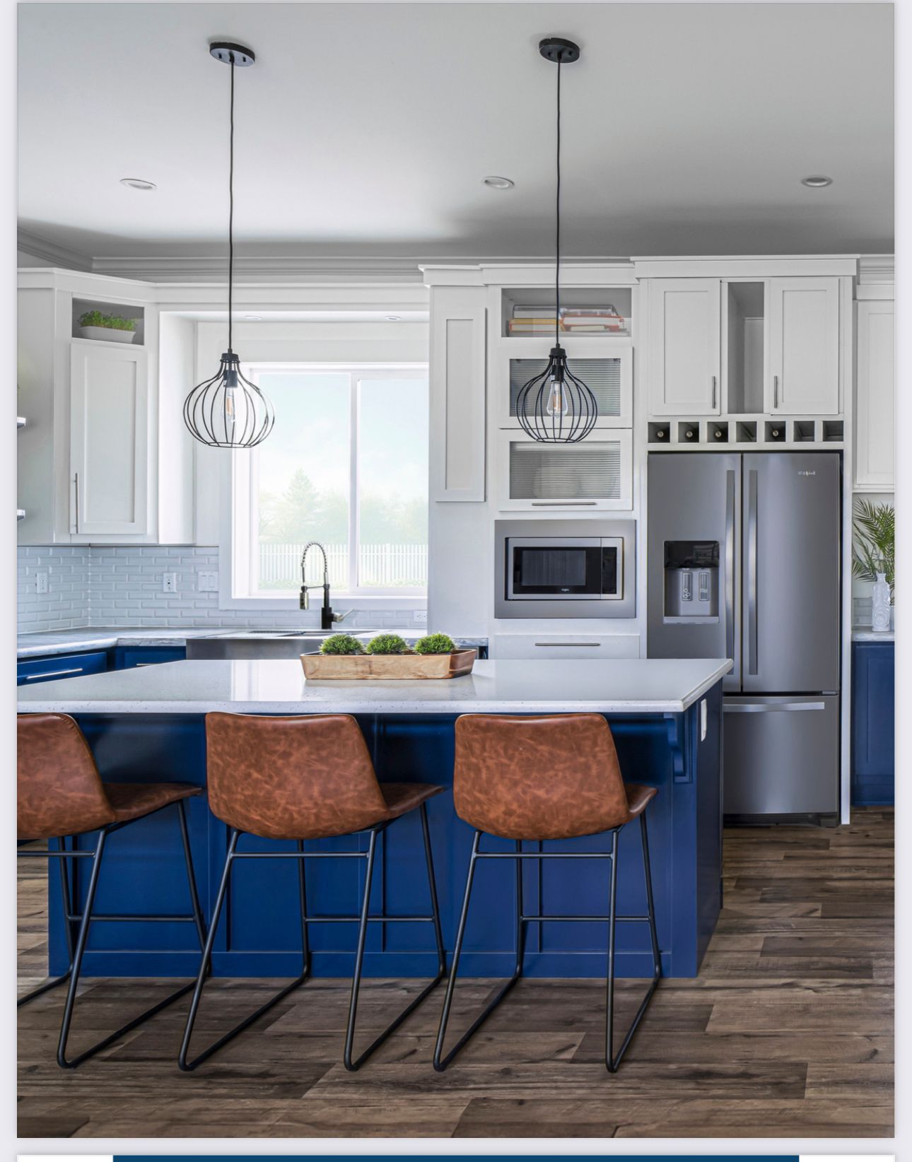 Perpetual Homes ADU: Modern kitchen with blue island, white cabinets, and brown leather bar stools.