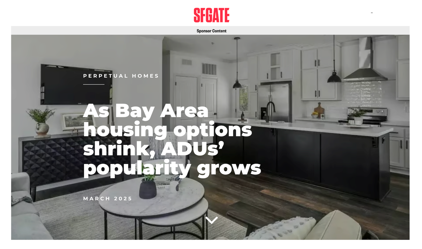 Bay Area home interior: kitchen with black island, white cabinets, and article title.