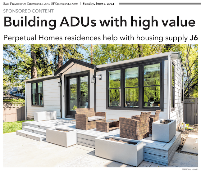 A modern ADU (Accessory Dwelling Unit) with a deck and patio furniture.