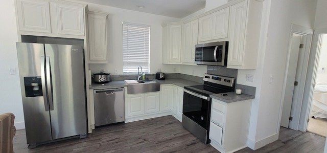 L Shaped Kitchen with Stainless Steel Appliances