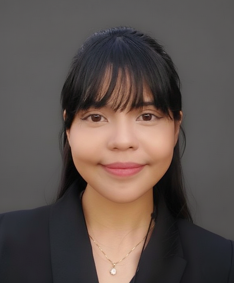 Vanessa Montes, Perpetual Homes ADU. Woman with dark hair and bangs, wearing a black blazer and necklace, smiling.