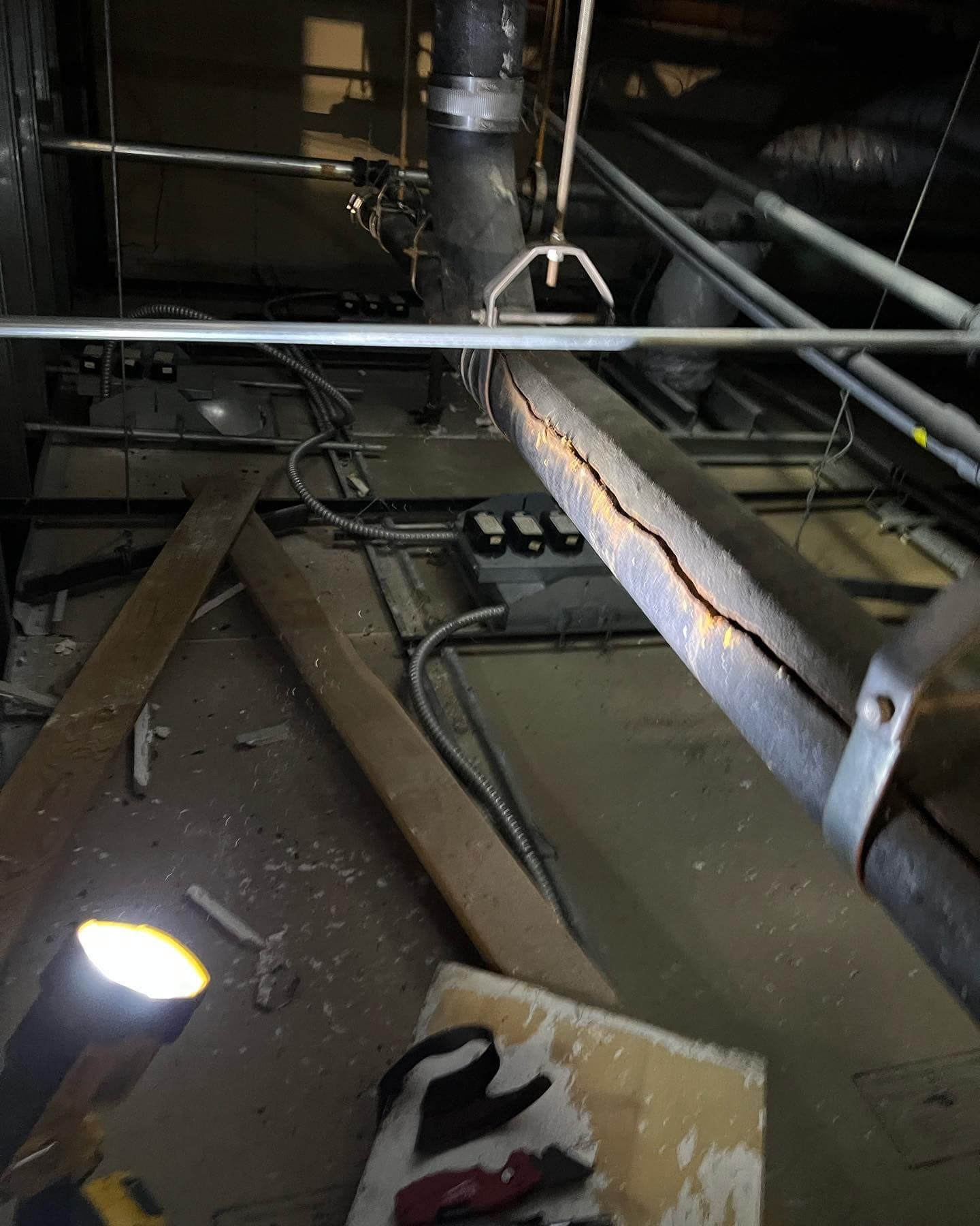 A room with a lot of wires hanging from the ceiling