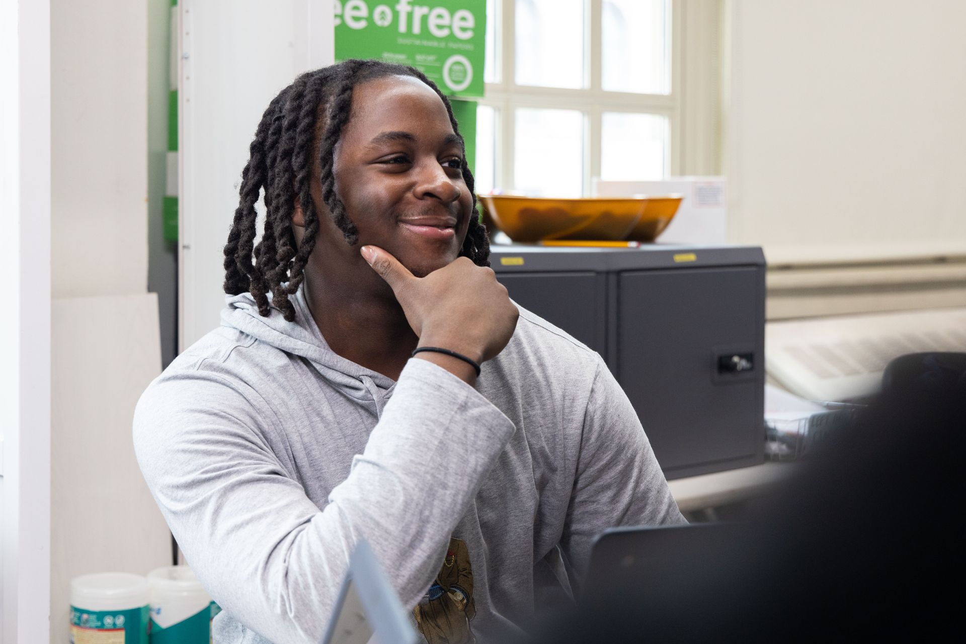 A student smiling in class