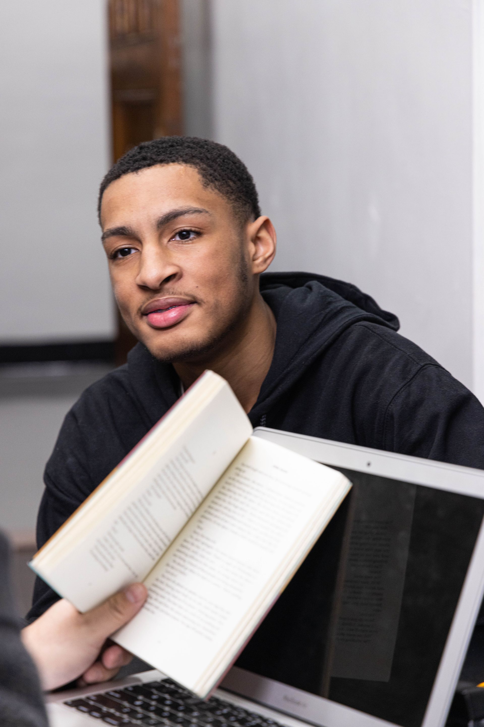 Smiling student with a book