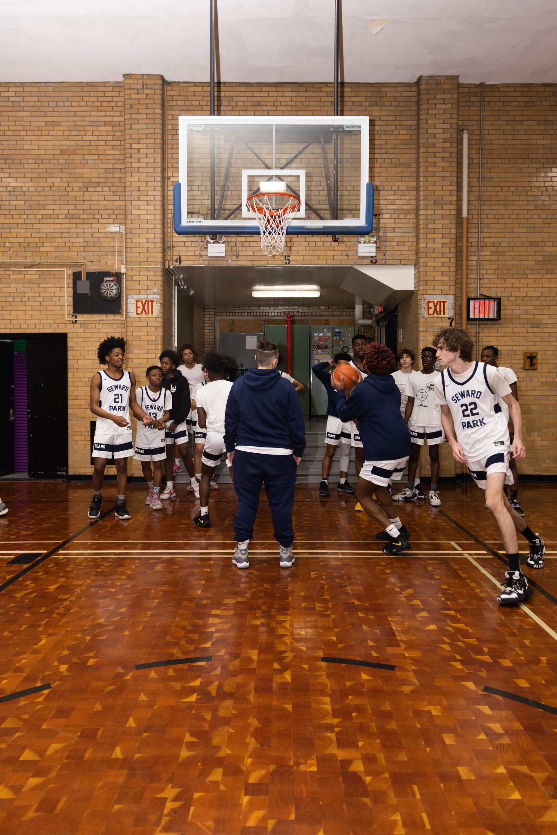 Student basketball team warming up with drills