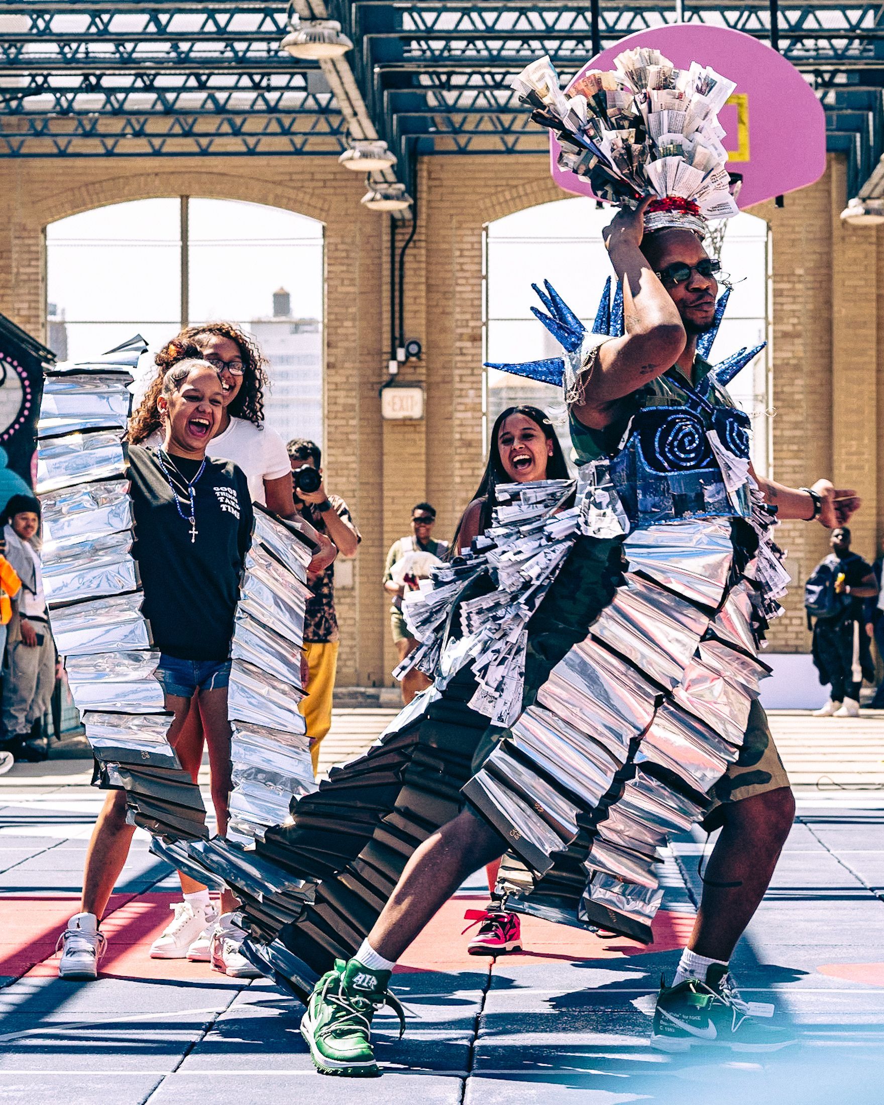 Host in a student-made garment at the 2023 Sustainable Fashion Show at New Design High School. Photo by Luis Suarez