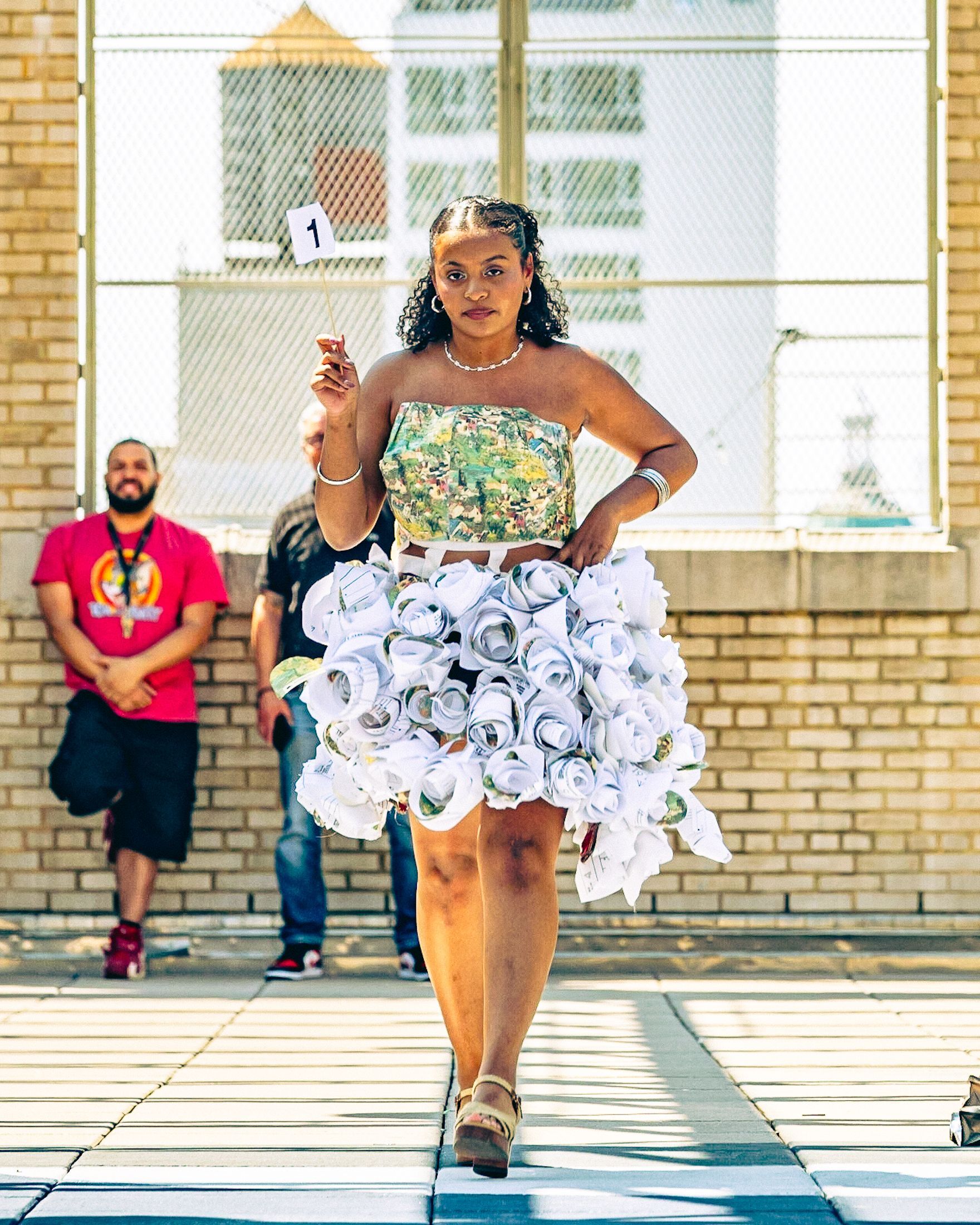 Model in hand-made garment at the 2023 Sustainable Fashion Show at New Design High School. Photo by Luis Suarez