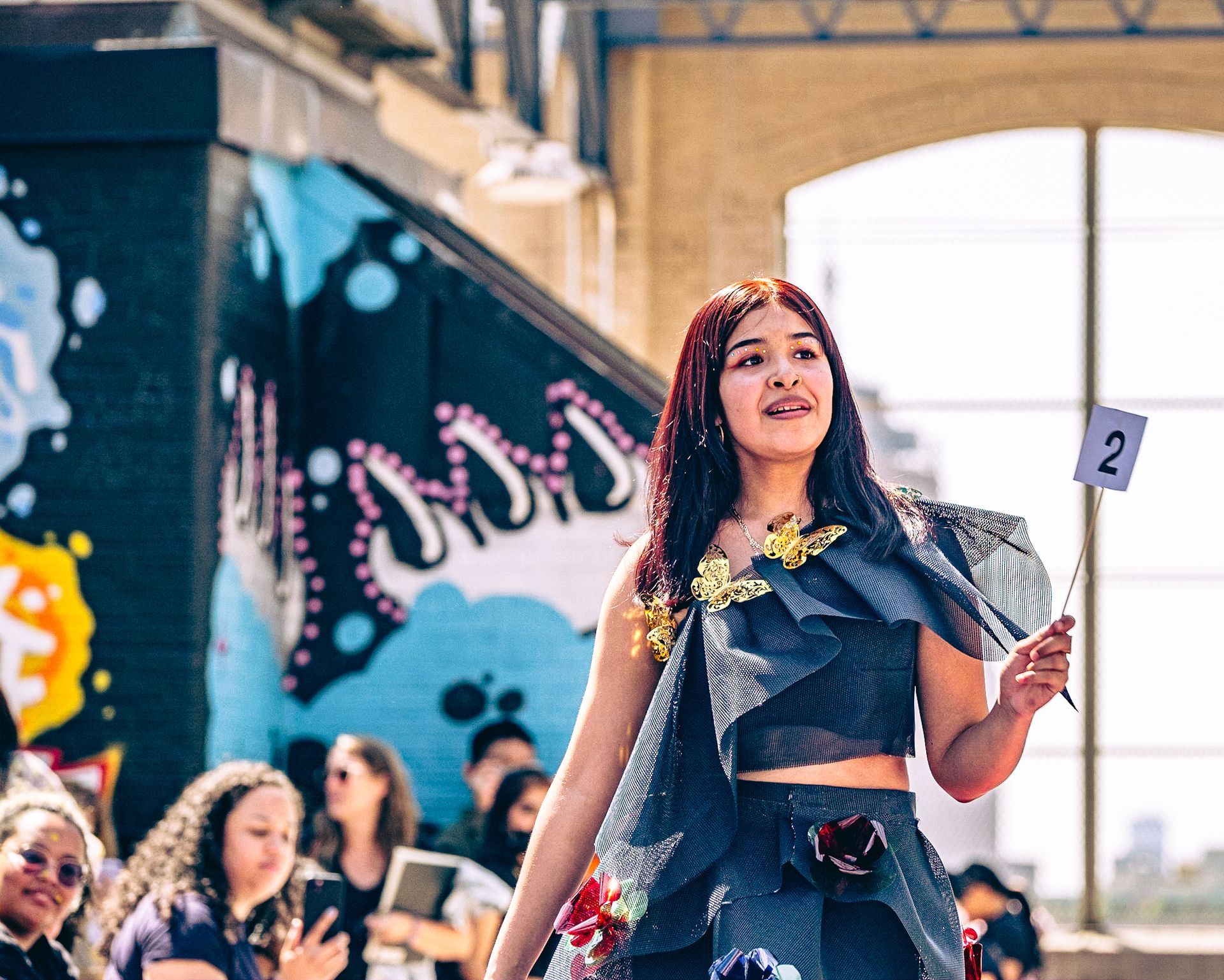Model in hand-made garment at the 2023 Sustainable Fashion Show at New Design High School. Photo by Luis Suarez