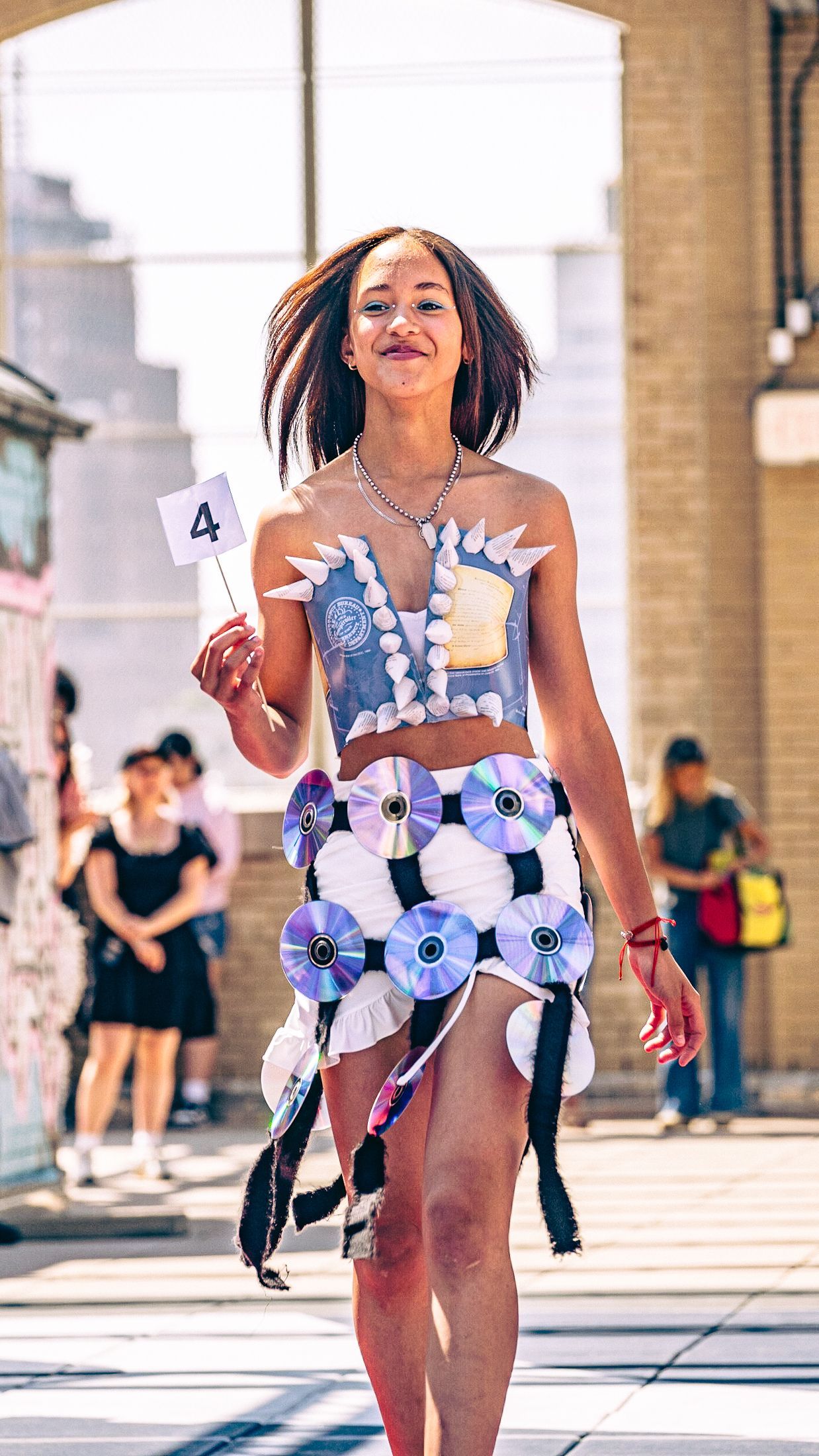 Model in hand-made garment at the 2023 Sustainable Fashion Show at New Design High School. Photo by Luis Suarez