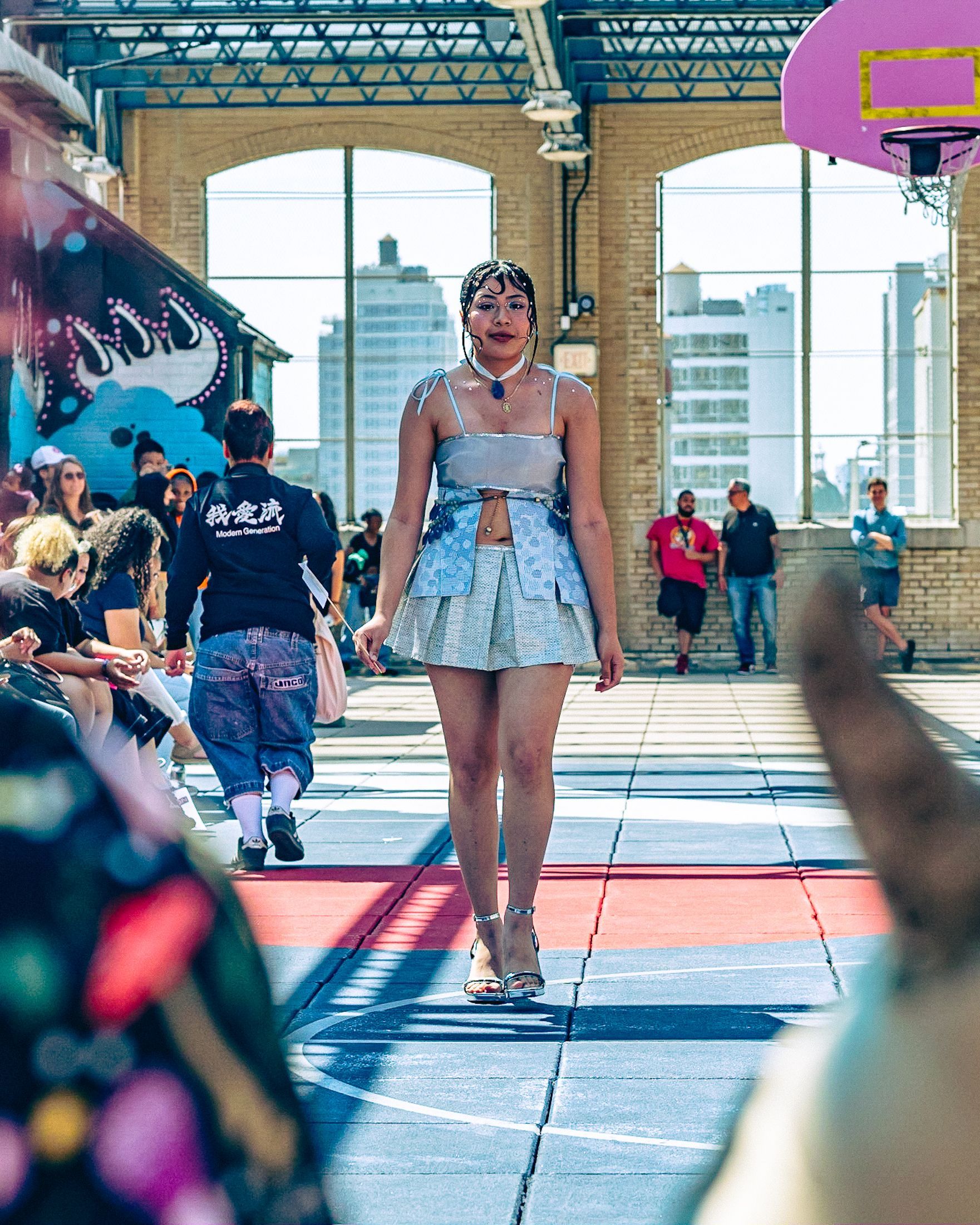 Model in hand-made garment at the 2023 Sustainable Fashion Show at New Design High School. Photo by Luis Suarez