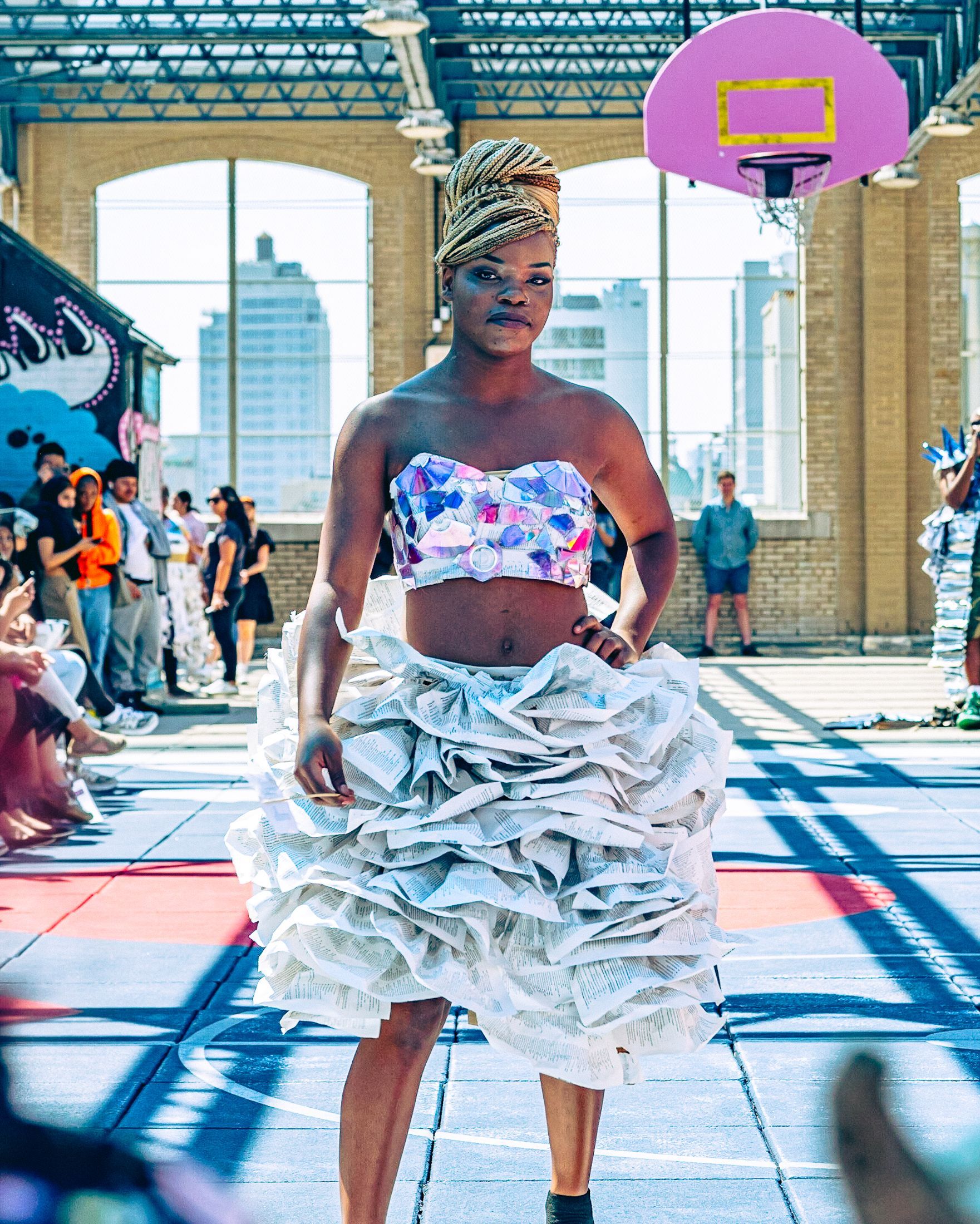Model in hand-made garment at the 2023 Sustainable Fashion Show at New Design High School. Photo by Luis Suarez