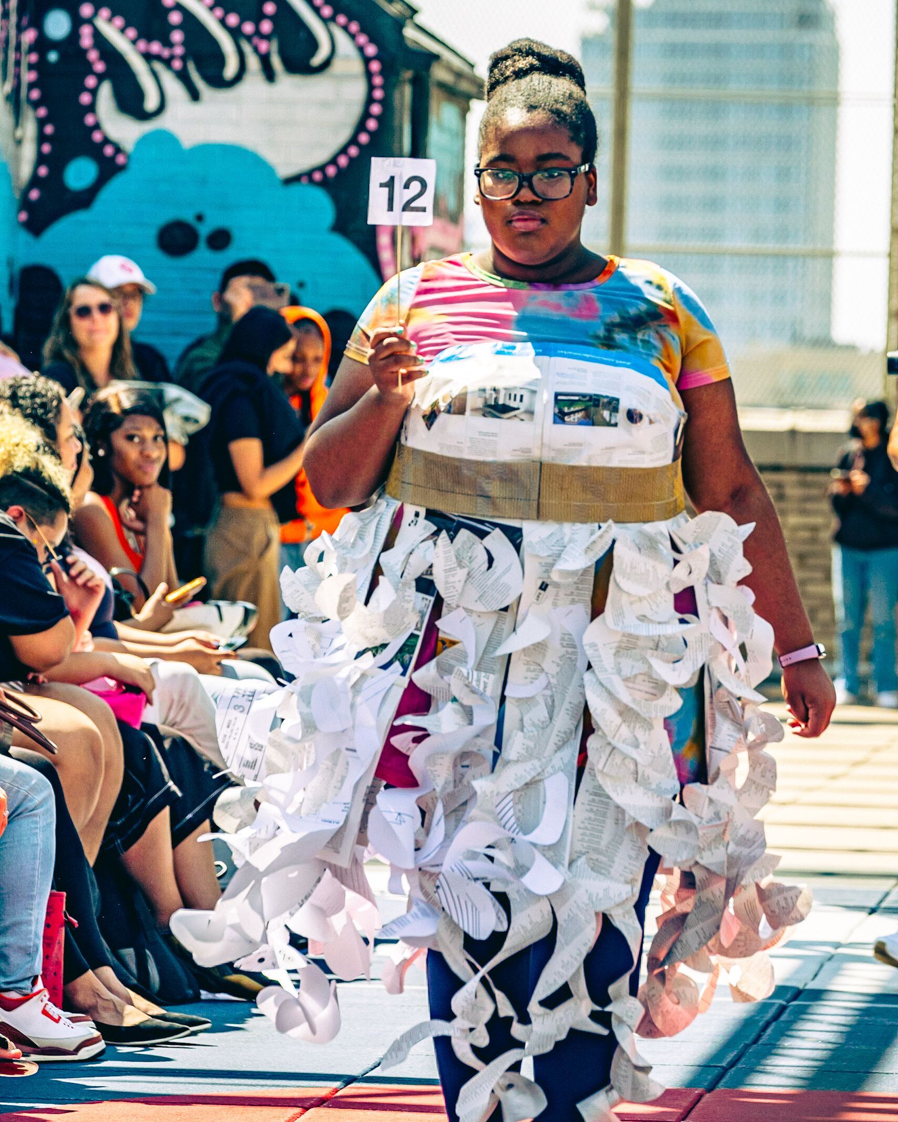 Model in hand-made garment at the 2023 Sustainable Fashion Show at New Design High School. Photo by Luis Suarez