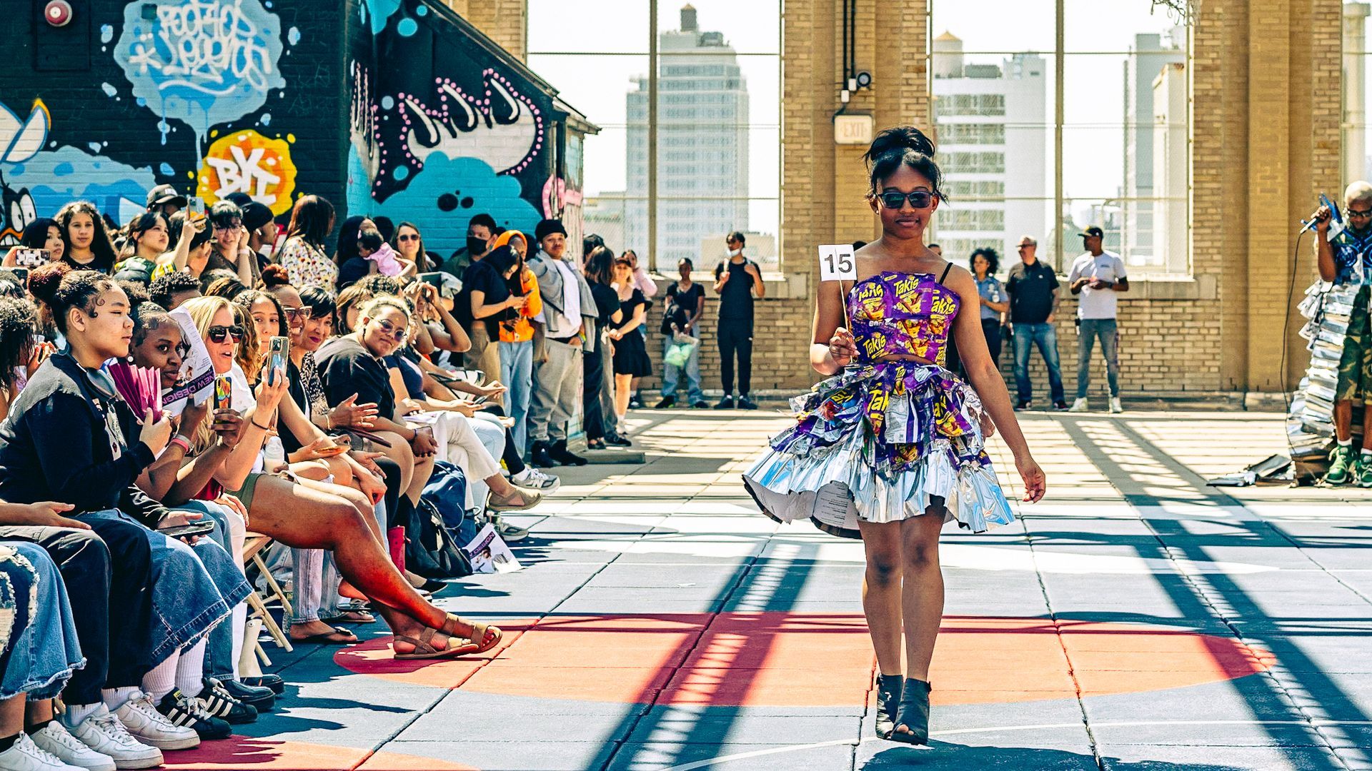 Model in hand-made garment at the 2023 Sustainable Fashion Show at New Design High School. Photo by Luis Suarez