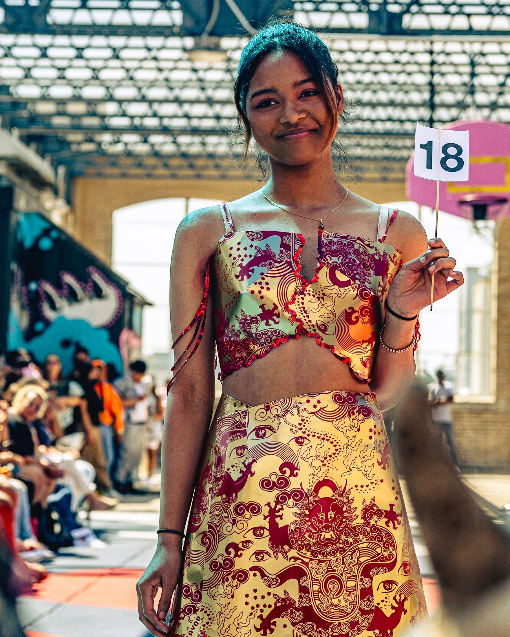 Model in hand-made garment at the 2023 Sustainable Fashion Show at New Design High School. Photo by Luis Suarez