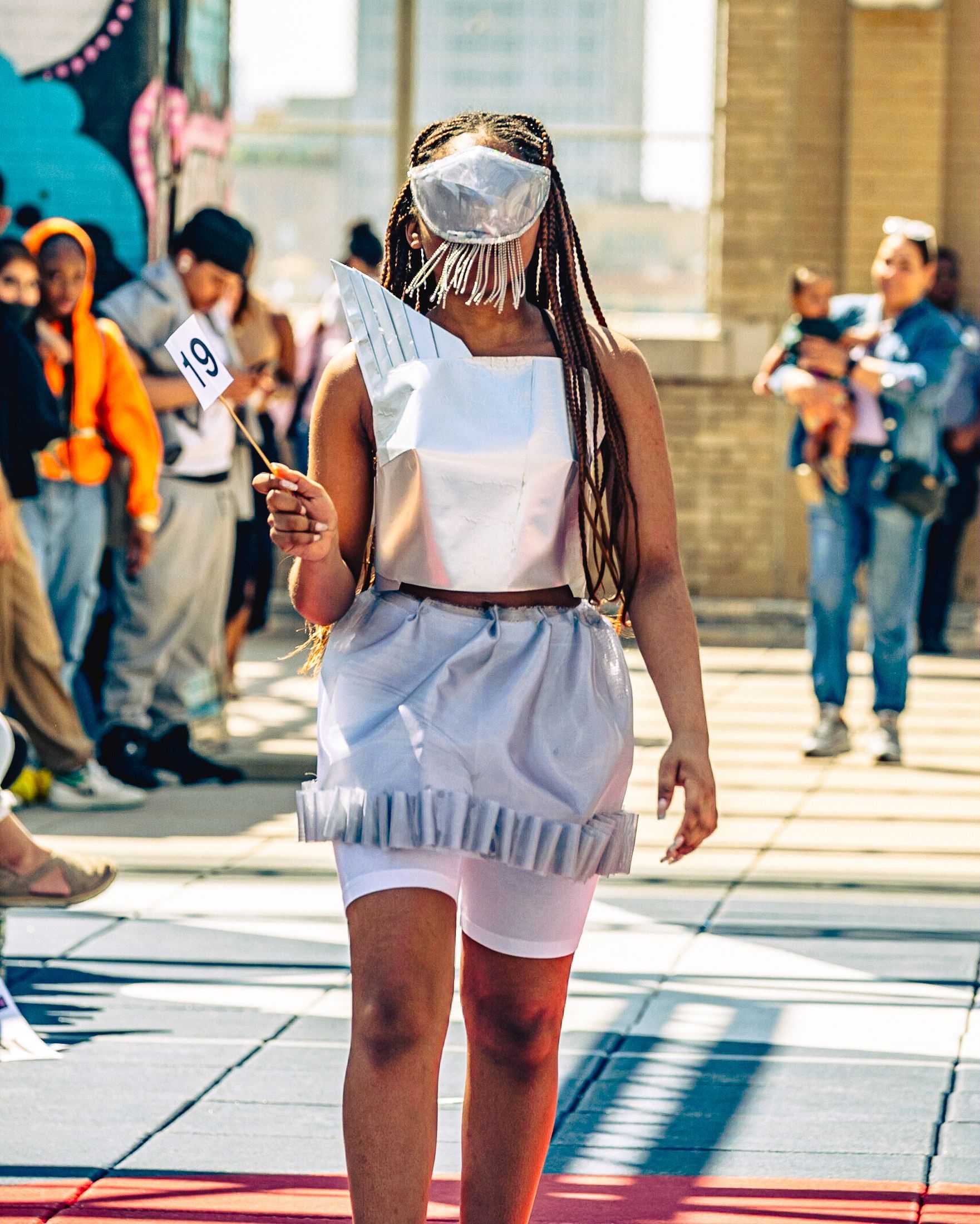 Model in hand-made garment at the 2023 Sustainable Fashion Show at New Design High School. Photo by Luis Suarez