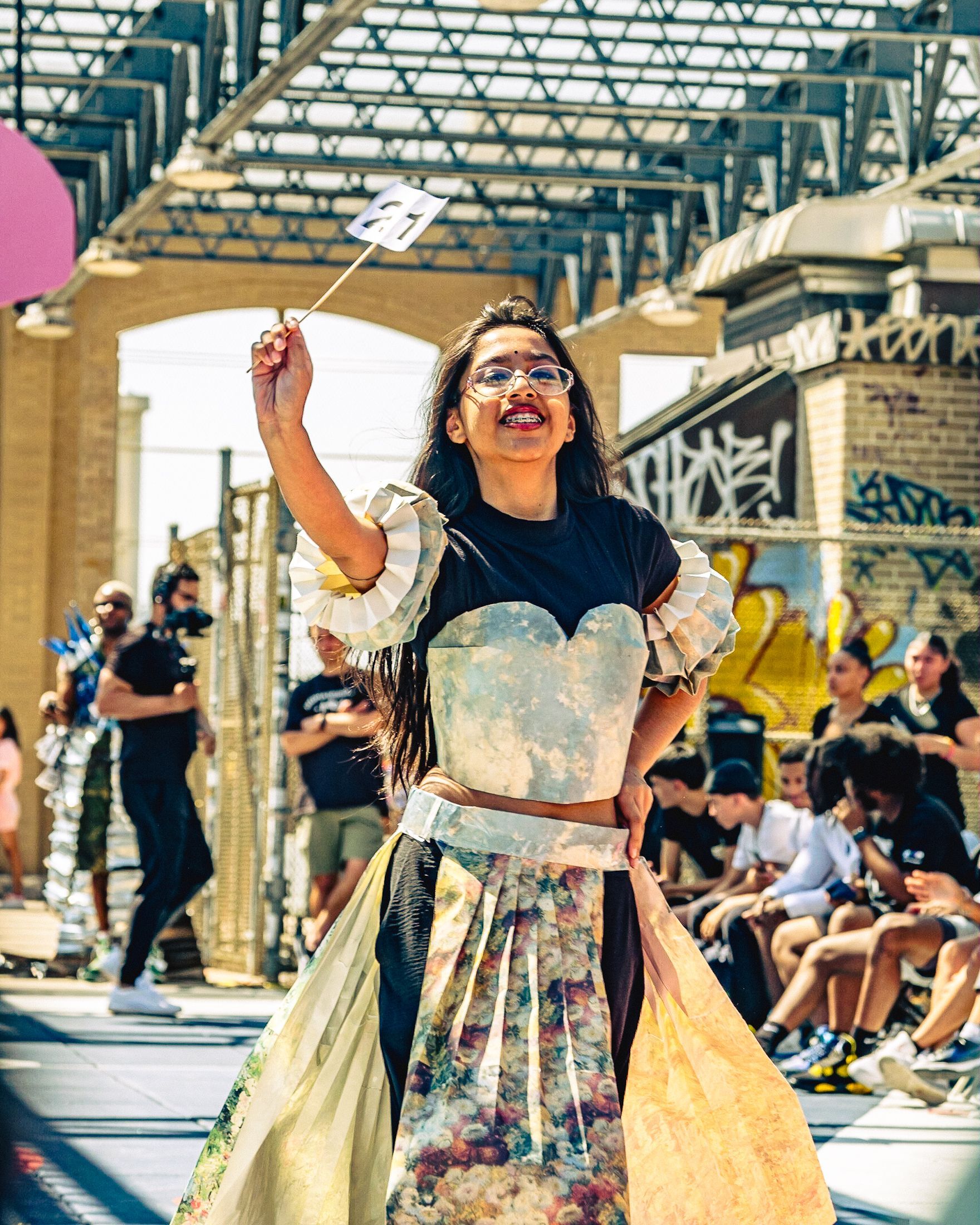 Model in hand-made garment at the 2023 Sustainable Fashion Show at New Design High School. Photo by Luis Suarez