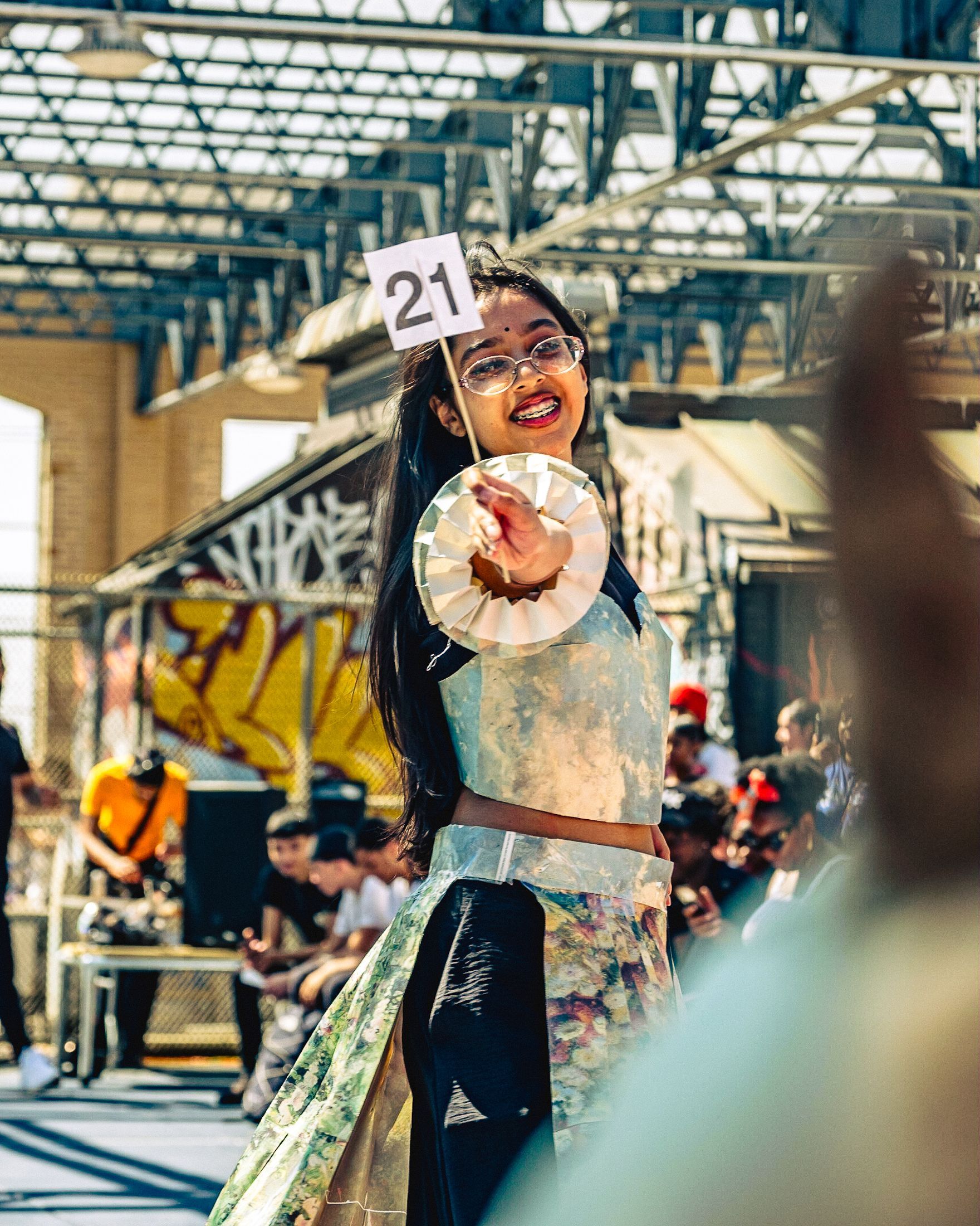 Model in hand-made garment at the 2023 Sustainable Fashion Show at New Design High School. Photo by Luis Suarez