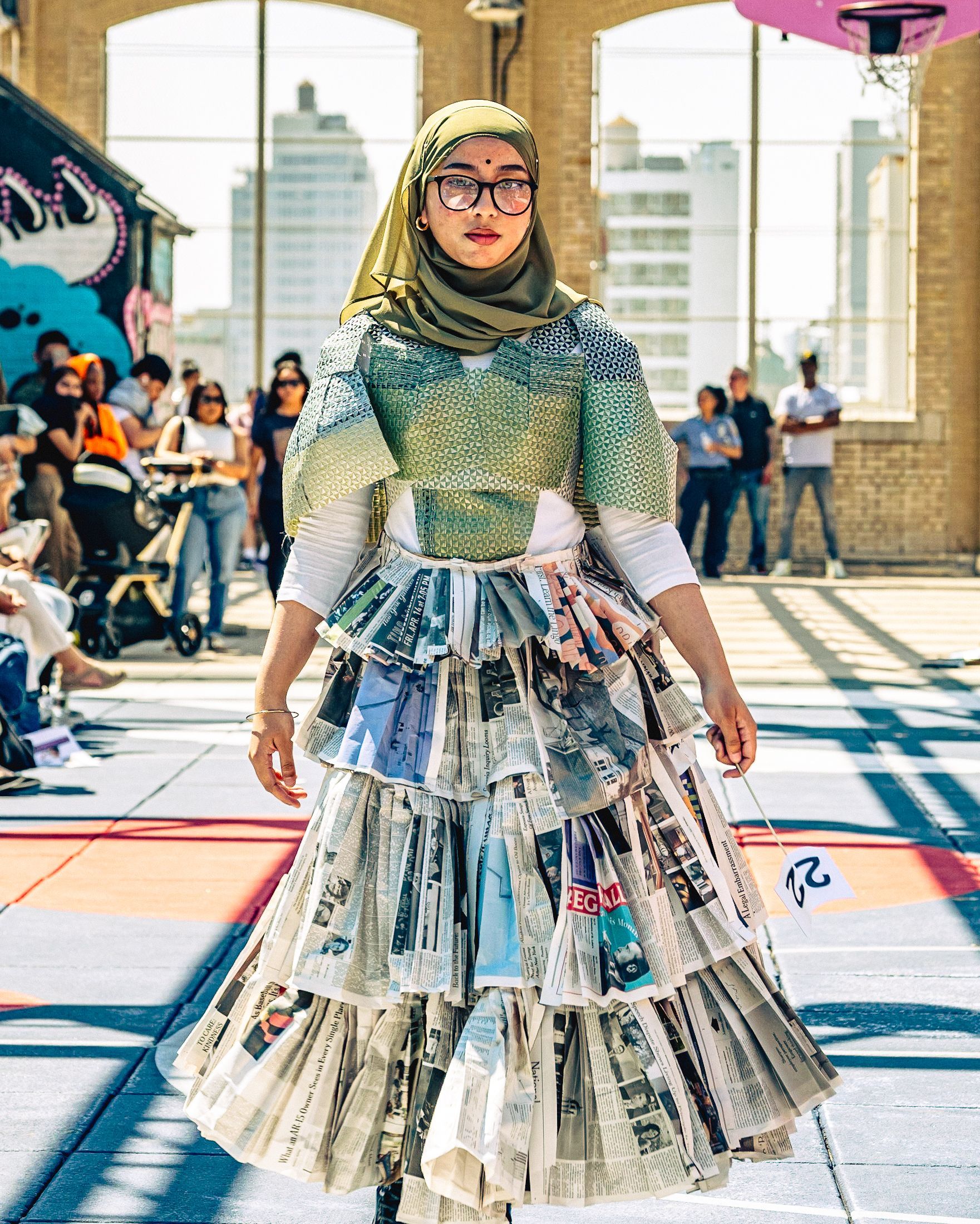 Model in hand-made garment at the 2023 Sustainable Fashion Show at New Design High School. Photo by Luis Suarez