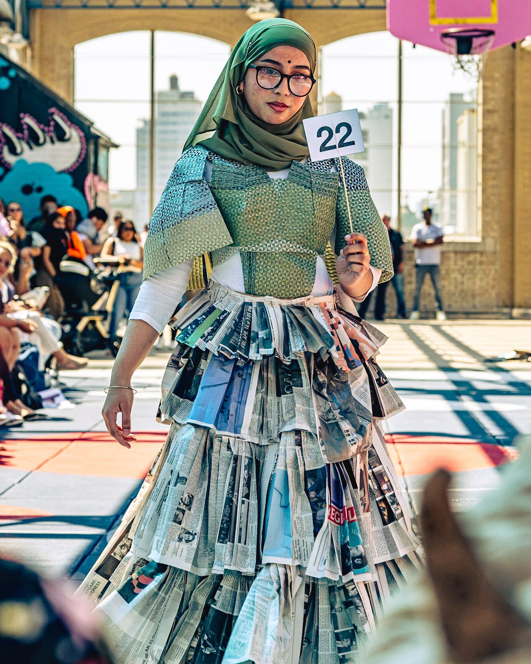 Model in hand-made garment at the 2023 Sustainable Fashion Show at New Design High School. Photo by Luis Suarez