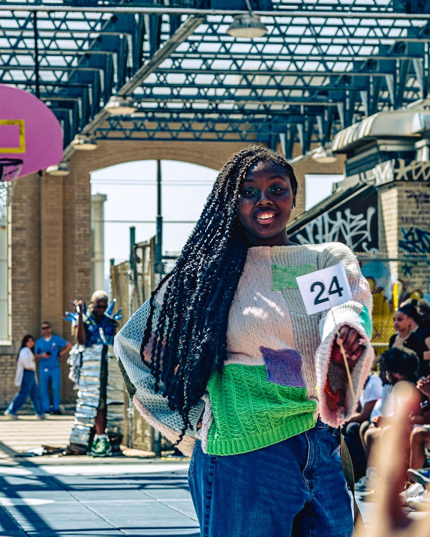 Model in hand-made garment at the 2023 Sustainable Fashion Show at New Design High School. Photo by Luis Suarez