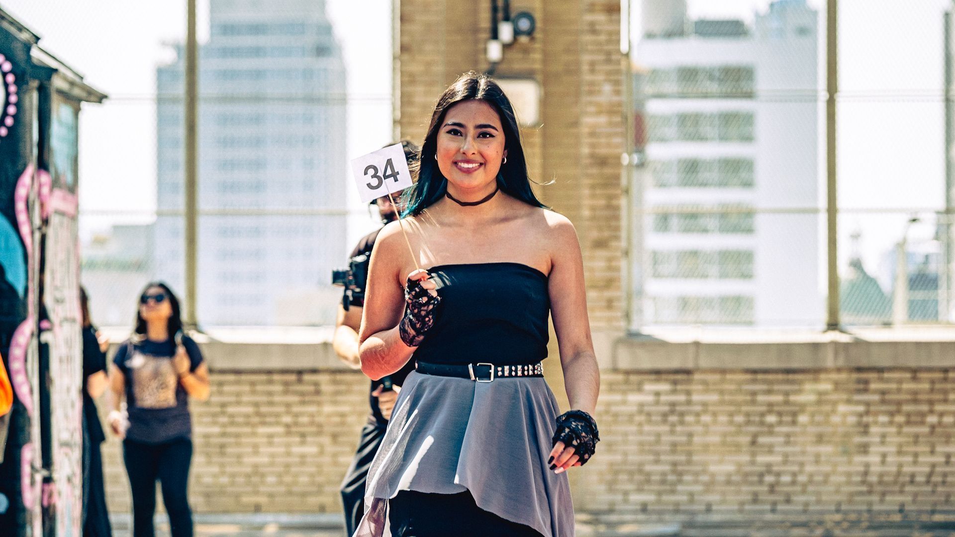 Model in hand-made garment at the 2023 Sustainable Fashion Show at New Design High School. Photo by Luis Suarez