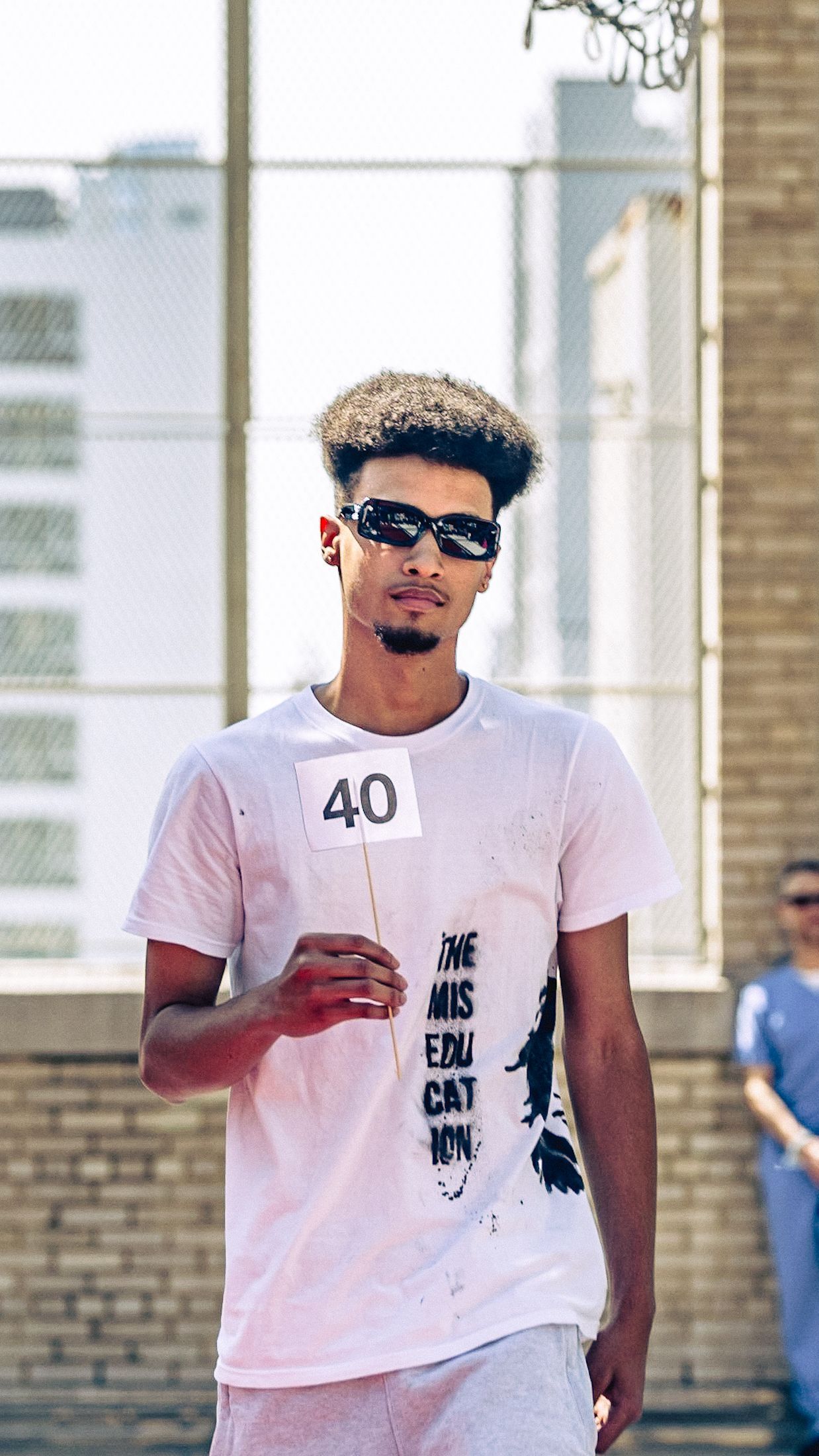 Model in hand-made garment at the 2023 Sustainable Fashion Show at New Design High School. Photo by Luis Suarez
