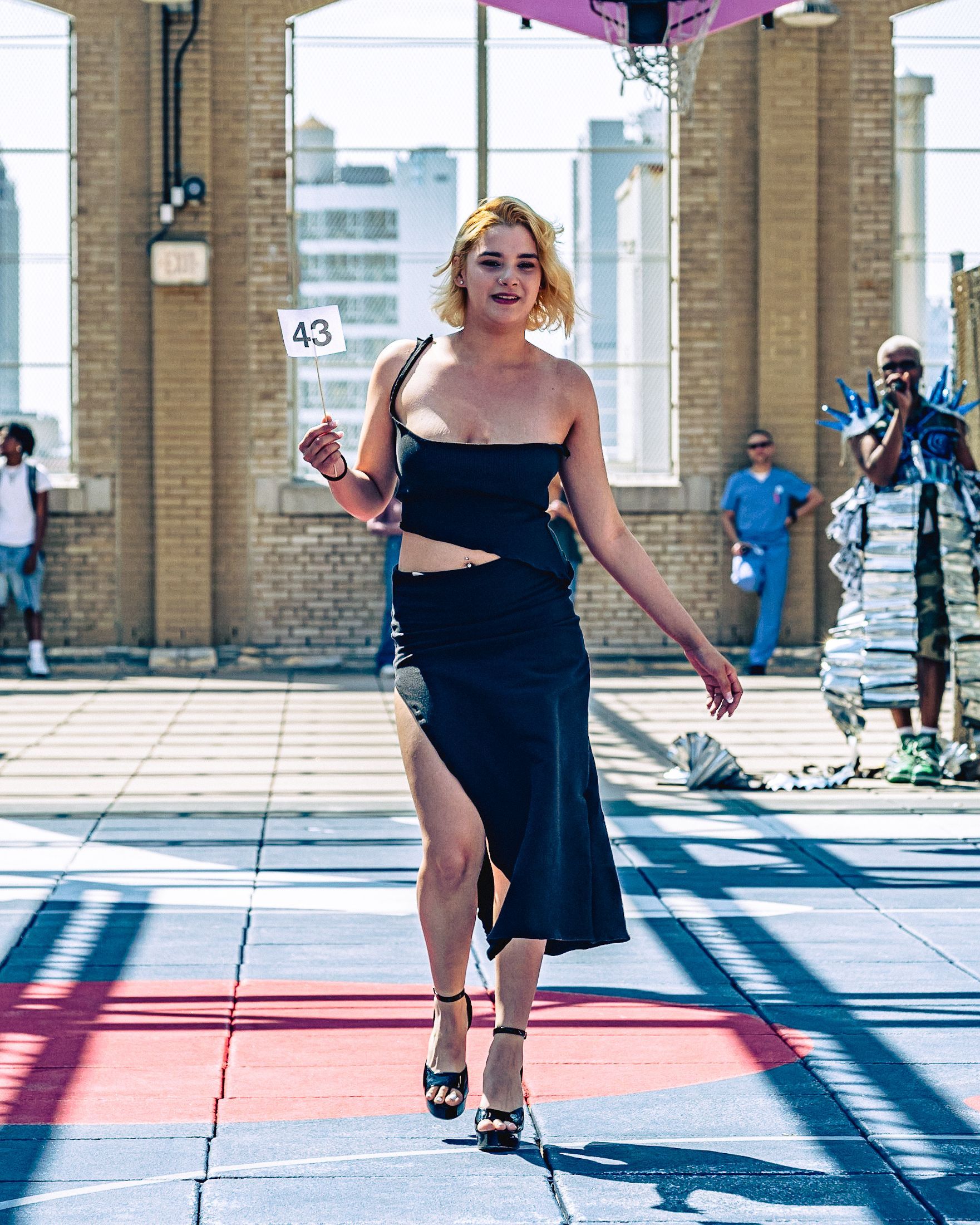 Model in hand-made garment at the 2023 Sustainable Fashion Show at New Design High School. Photo by Luis Suarez