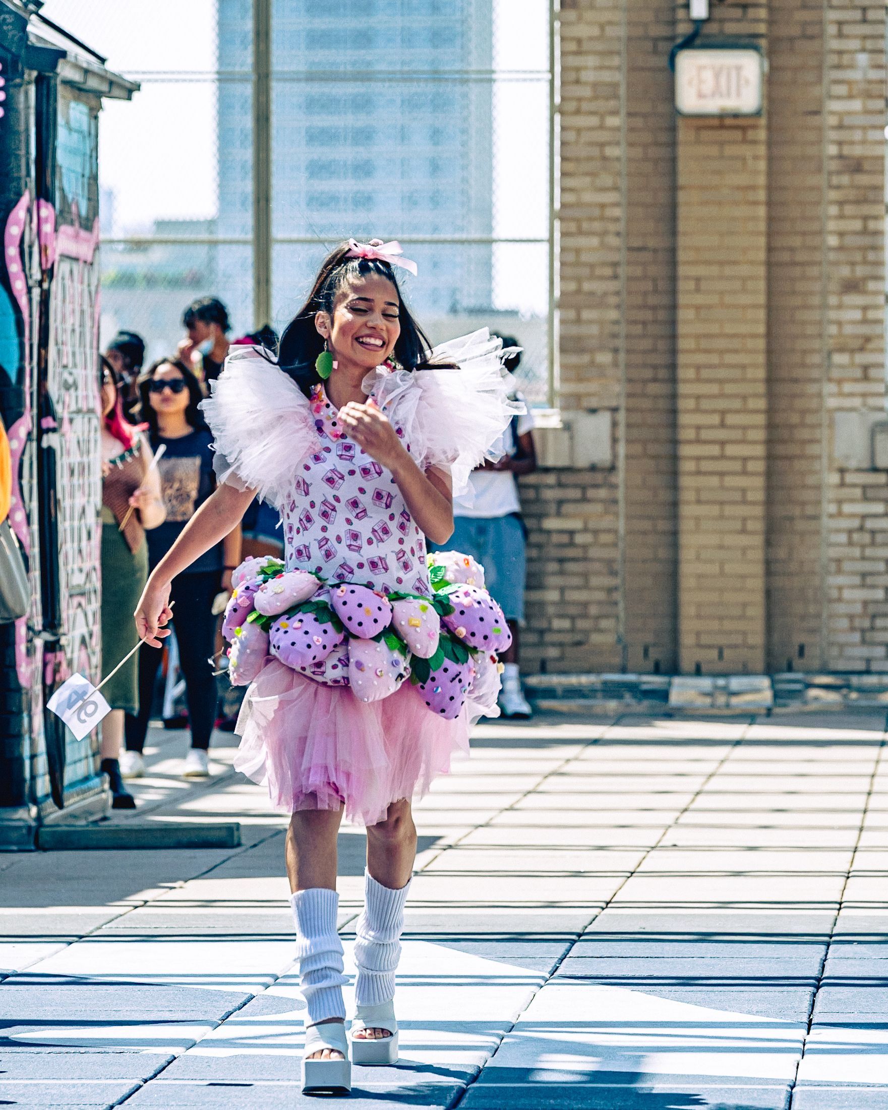 Model in hand-made garment at the 2023 Sustainable Fashion Show at New Design High School. Photo by Luis Suarez