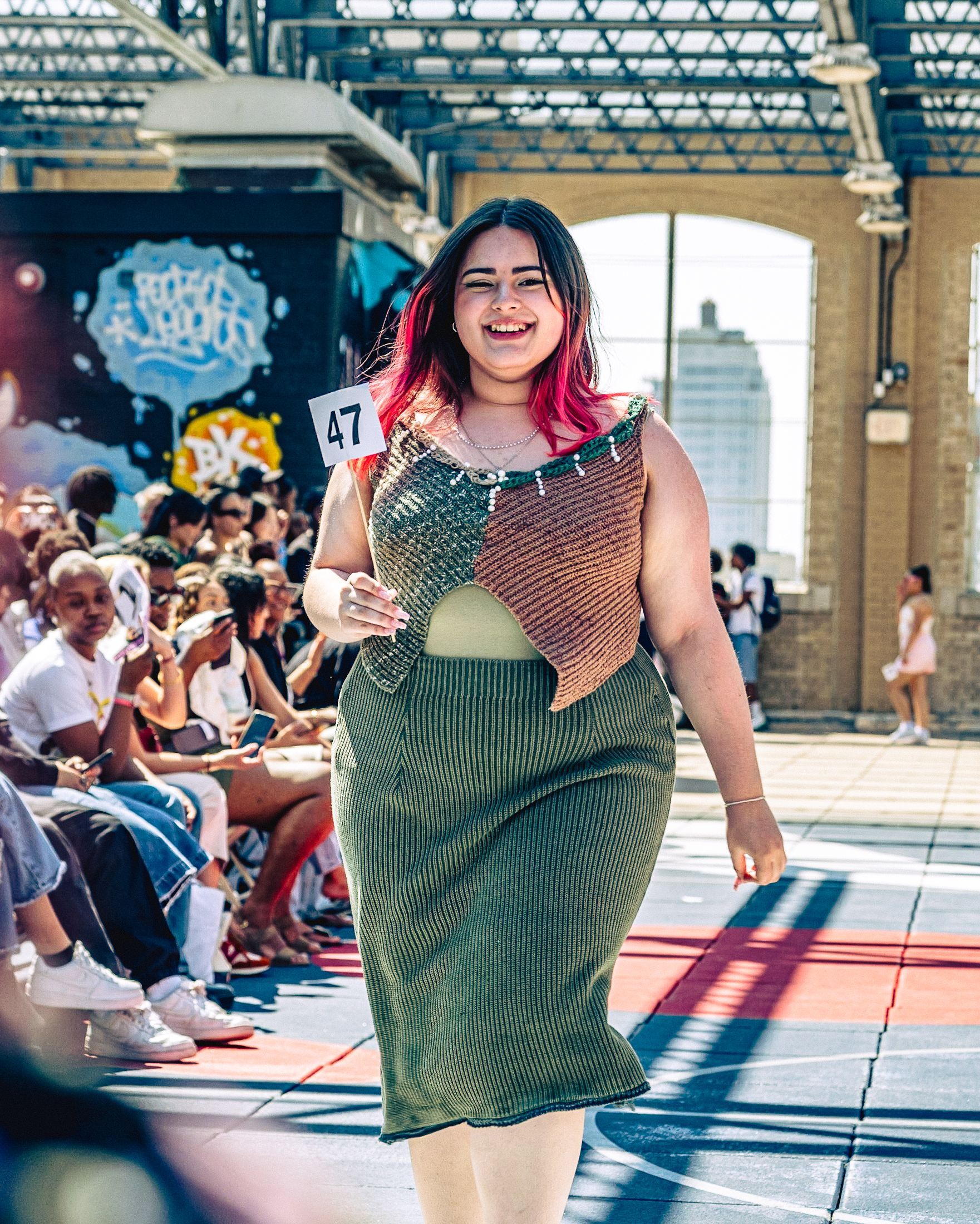 Model in hand-made garment at the 2023 Sustainable Fashion Show at New Design High School. Photo by Luis Suarez