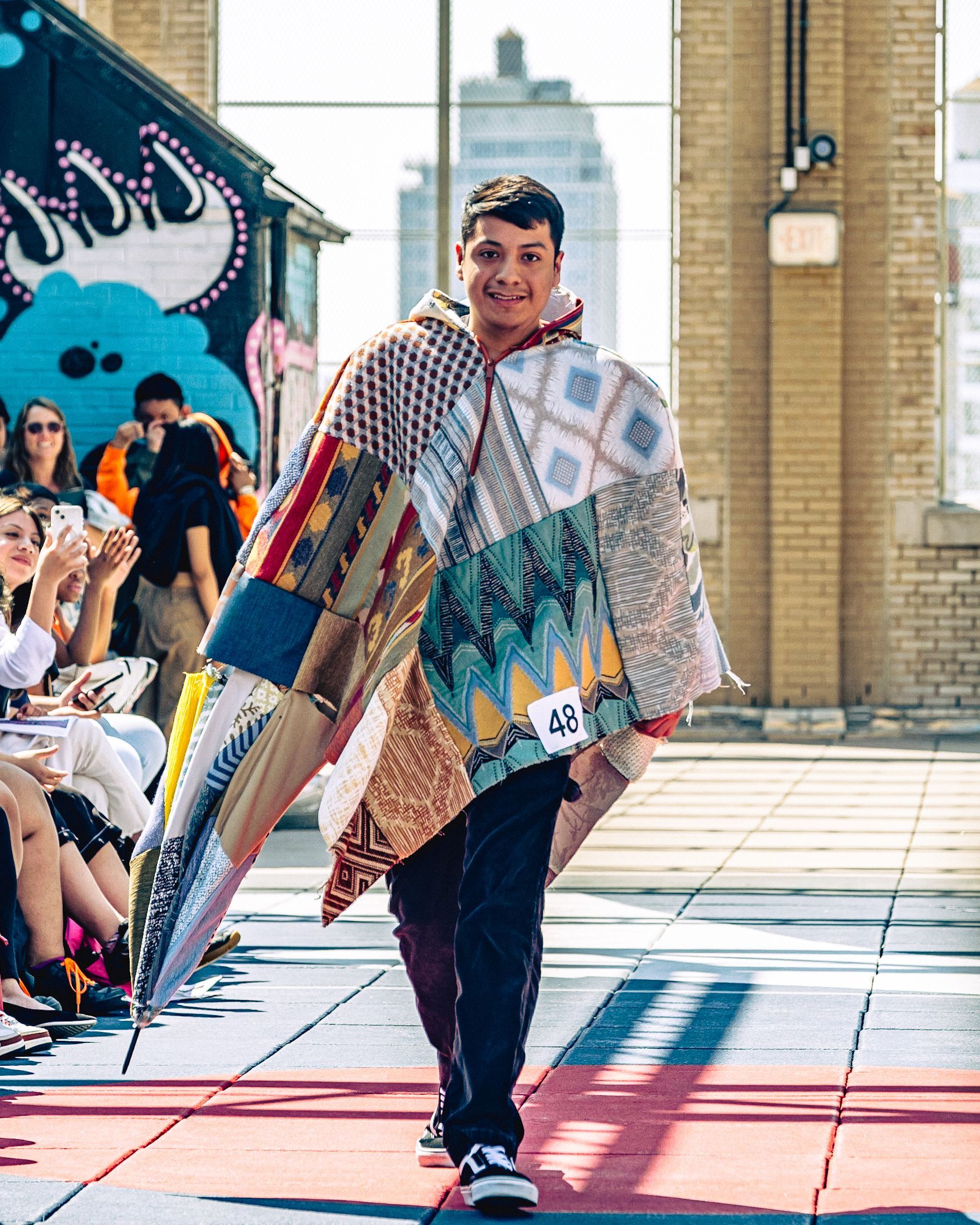 Model in hand-made garment at the 2023 Sustainable Fashion Show at New Design High School. Photo by Luis Suarez