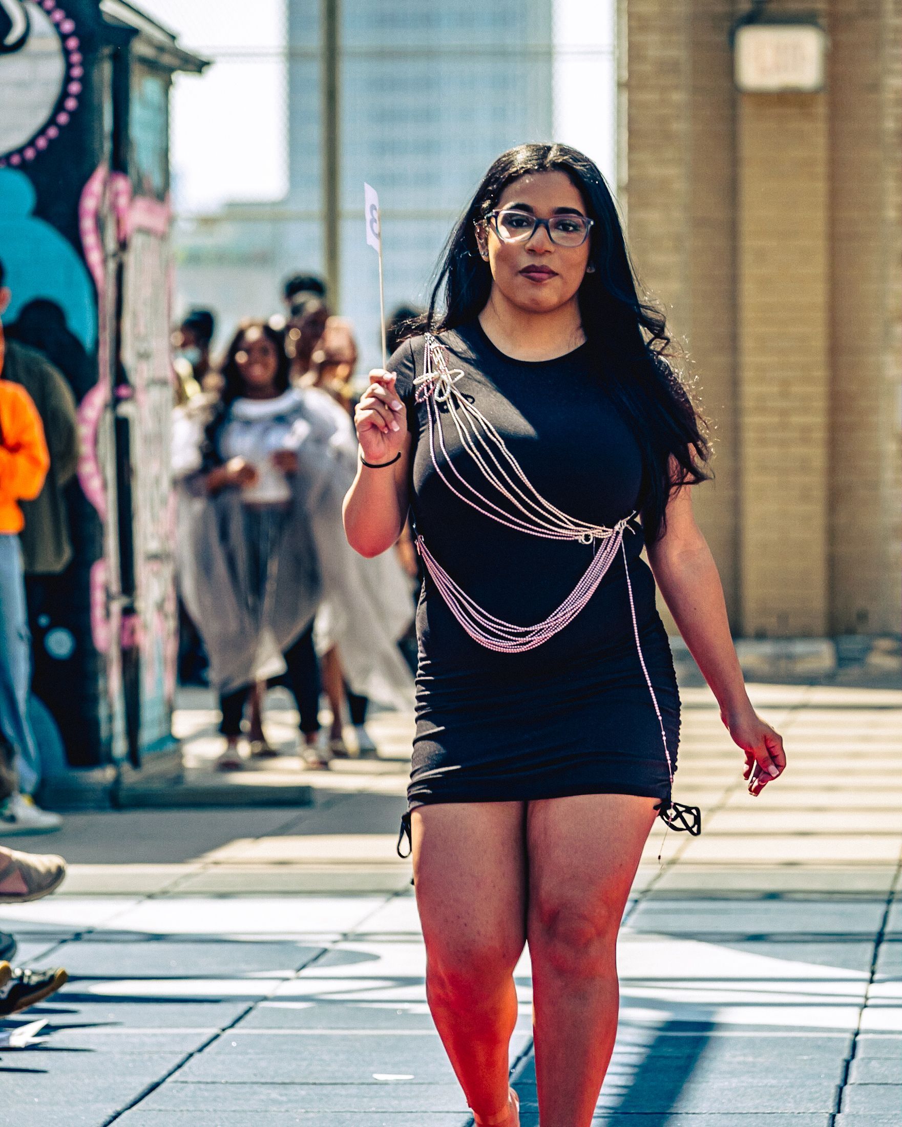 Model in hand-made garment at the 2023 Sustainable Fashion Show at New Design High School. Photo by Luis Suarez