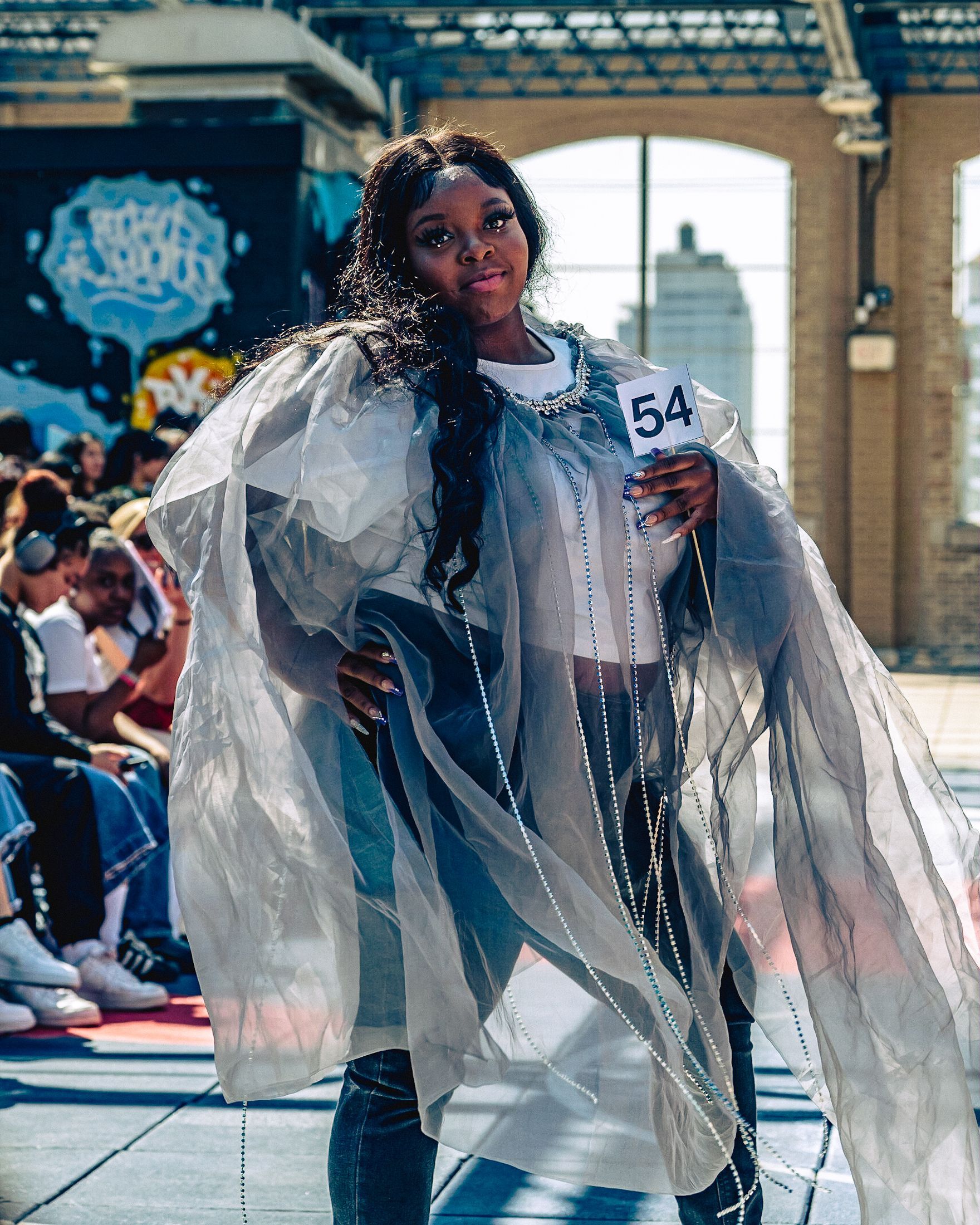 Model in hand-made garment at the 2023 Sustainable Fashion Show at New Design High School. Photo by Luis Suarez