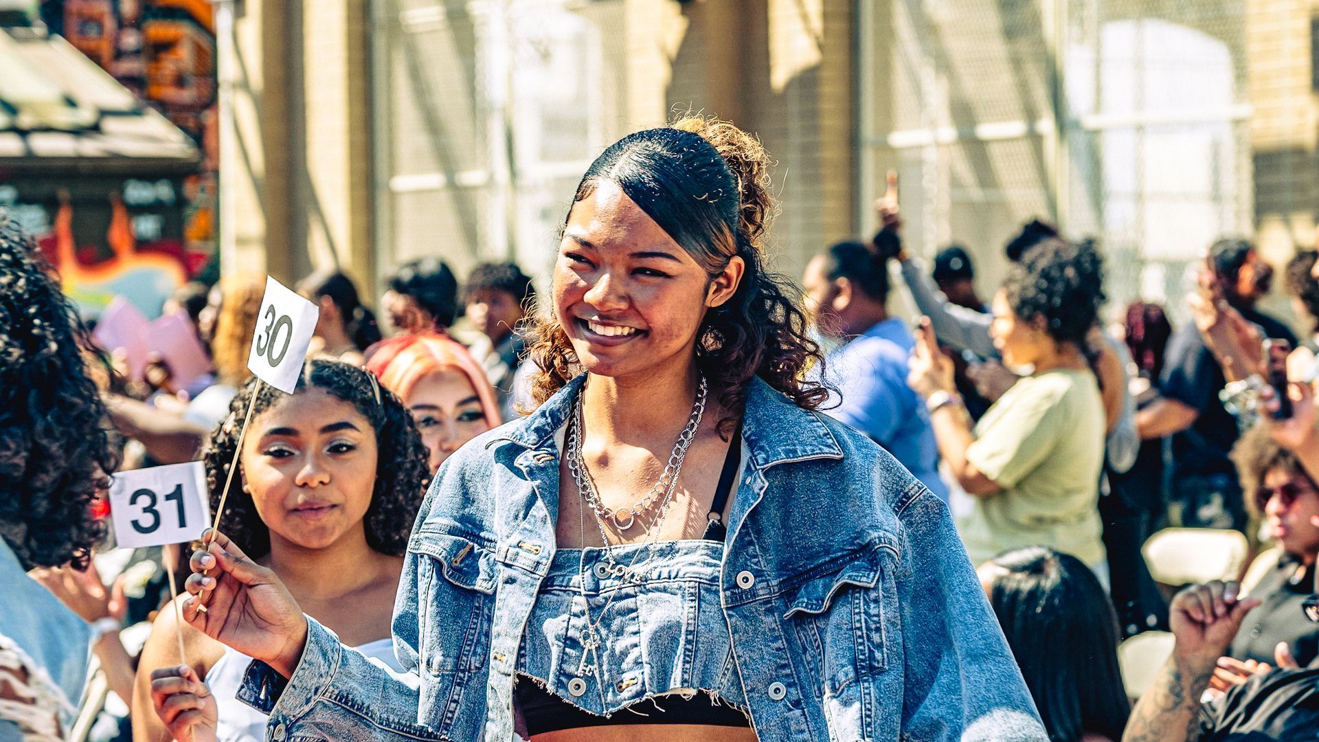 Model in hand-made garment at the 2023 Sustainable Fashion Show at New Design High School. Photo by Luis Suarez