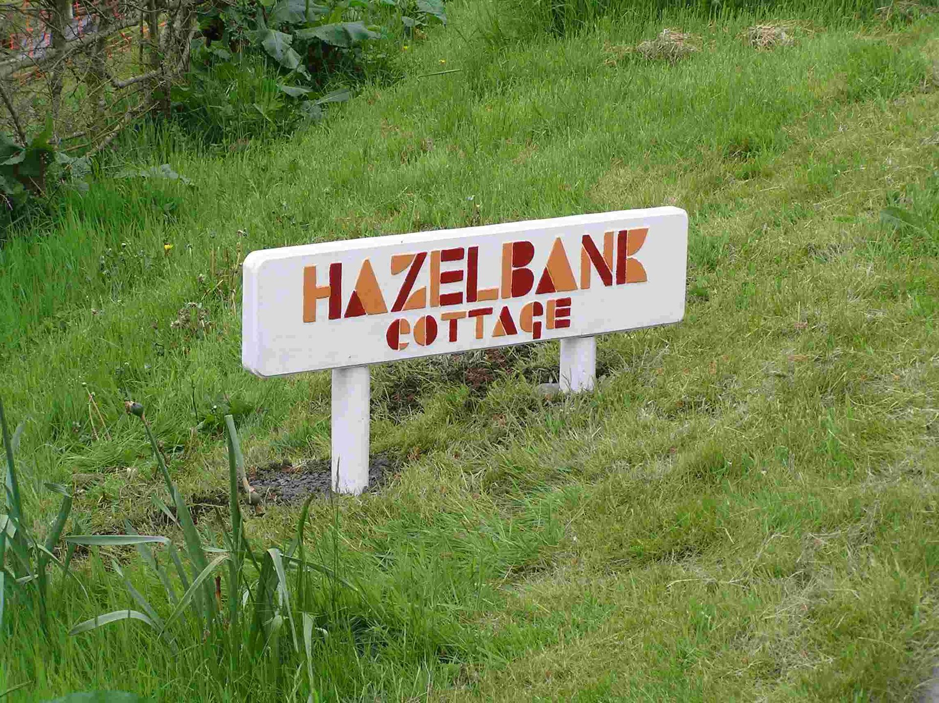 A modernist painted wooden house name sign made by Ingrained Culture