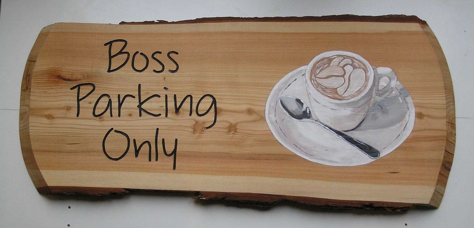 A wooden café sign made by Robert Ingrained Culture