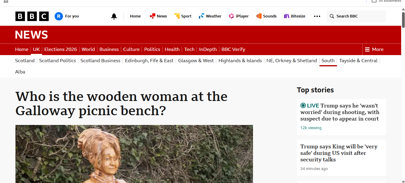 Screenshot of the BBC news report of Robert Lawrence's life size wooden woman public art sculpture, on tour.